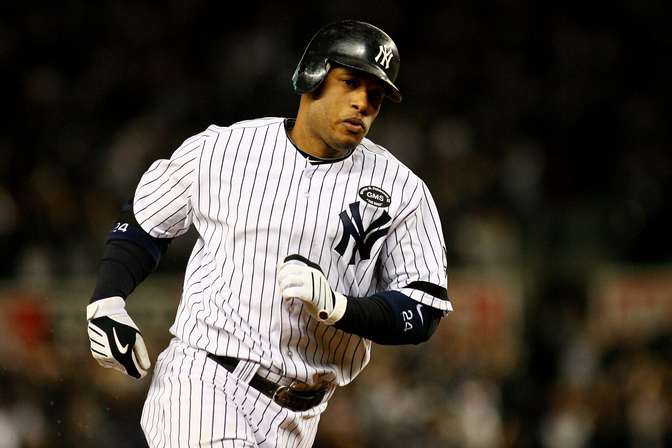 NEW YORK - OCTOBER 19: Robinson Cano #24 of the New York Yankees round the bases after hitting a solo homerun in the second inning against Tommy Hunter #35 of the Texas Rangers look on in Game Four of the ALCS during the 2010 MLB Playoffs at Yankee Stadi NEW YORK - OCTOBER 19: Robinson Cano #24 of the New York Yankees round the bases after hitting a solo homerun in the second inning against Tommy Hunter #35 of the Texas Rangers look on in Game Four of the ALCS during the 2010 MLB Playoffs at Yankee Stadi