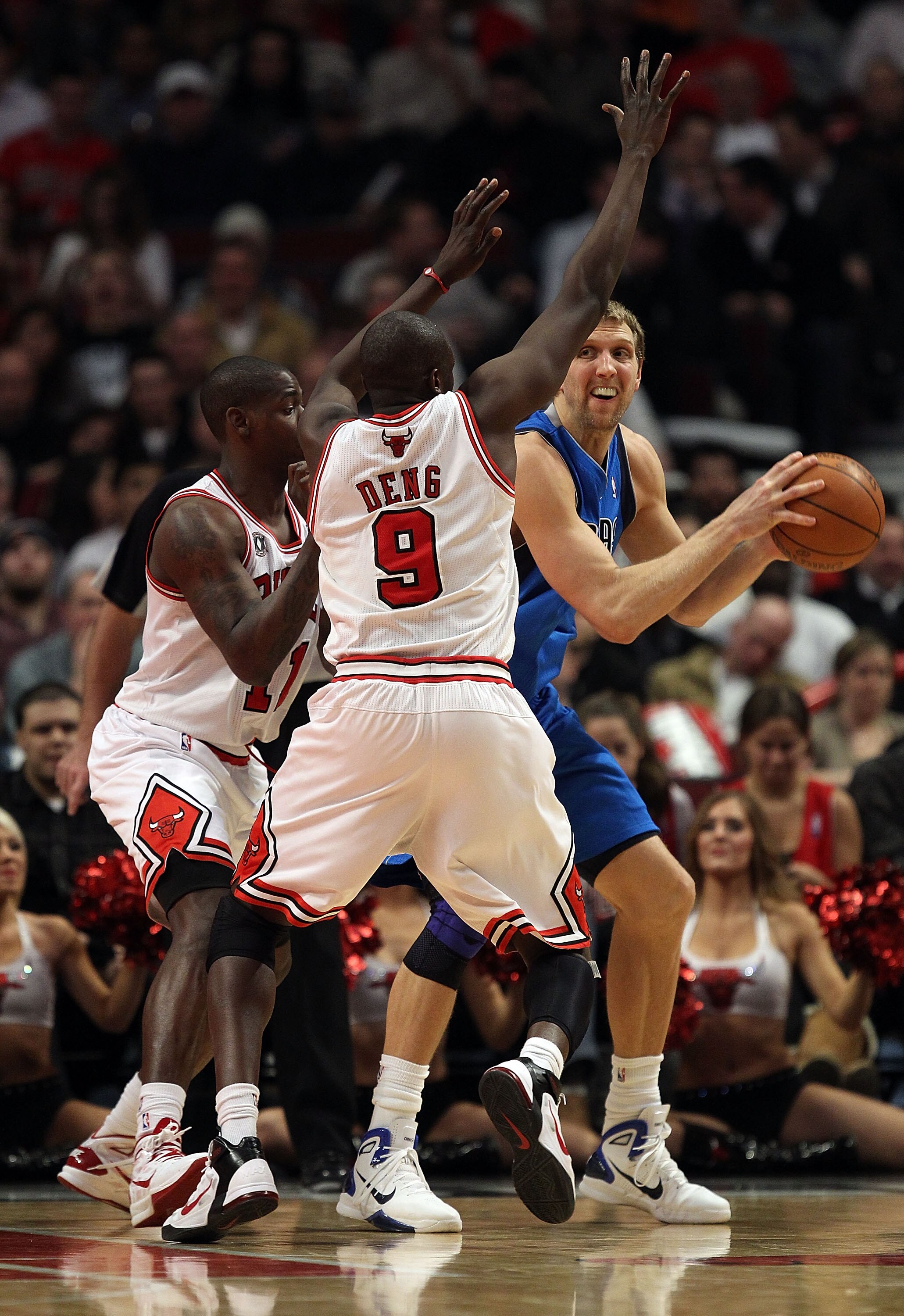 CHICAGO, IL - JANUARY 20: Dirk Nowitzki #41 of the Dallas Mavericks looks to pass under pressure from Ronnie Brewer #11 and Loul Deng #9 of the Chicago Bulls at the United Center on January 20, 2011 in Chicago, Illinois. The Bulls defeated the Mavericks 8