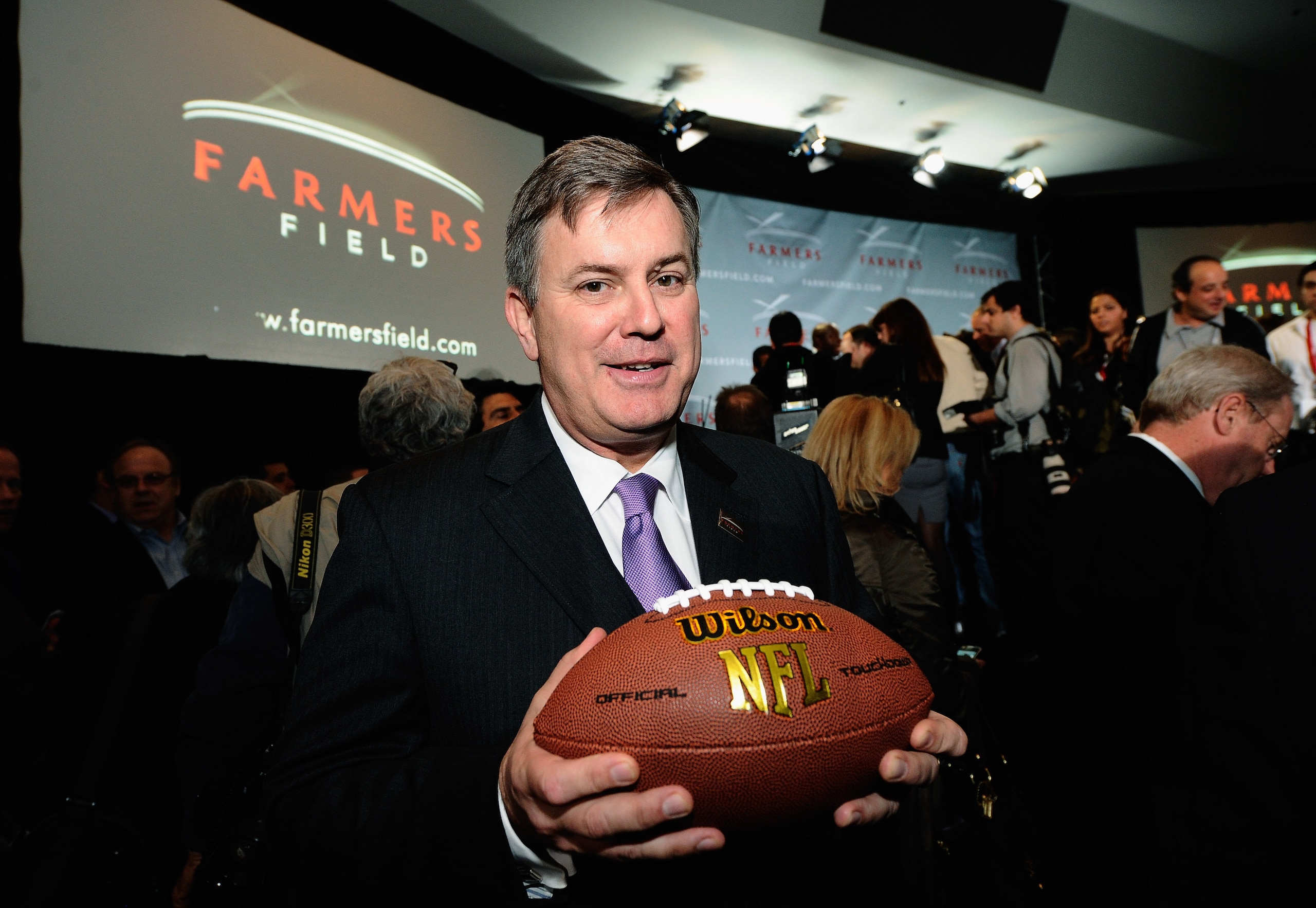 LOS ANGELES, CA - FEBRUARY 01:  Tim Leiweke, President and CEO of AEG holds a football after he  announced naming rights for the new football stadium Farmers Field at Los Angeles Convention Center on February 1, 2011 in Los Angeles, California. AEG has re