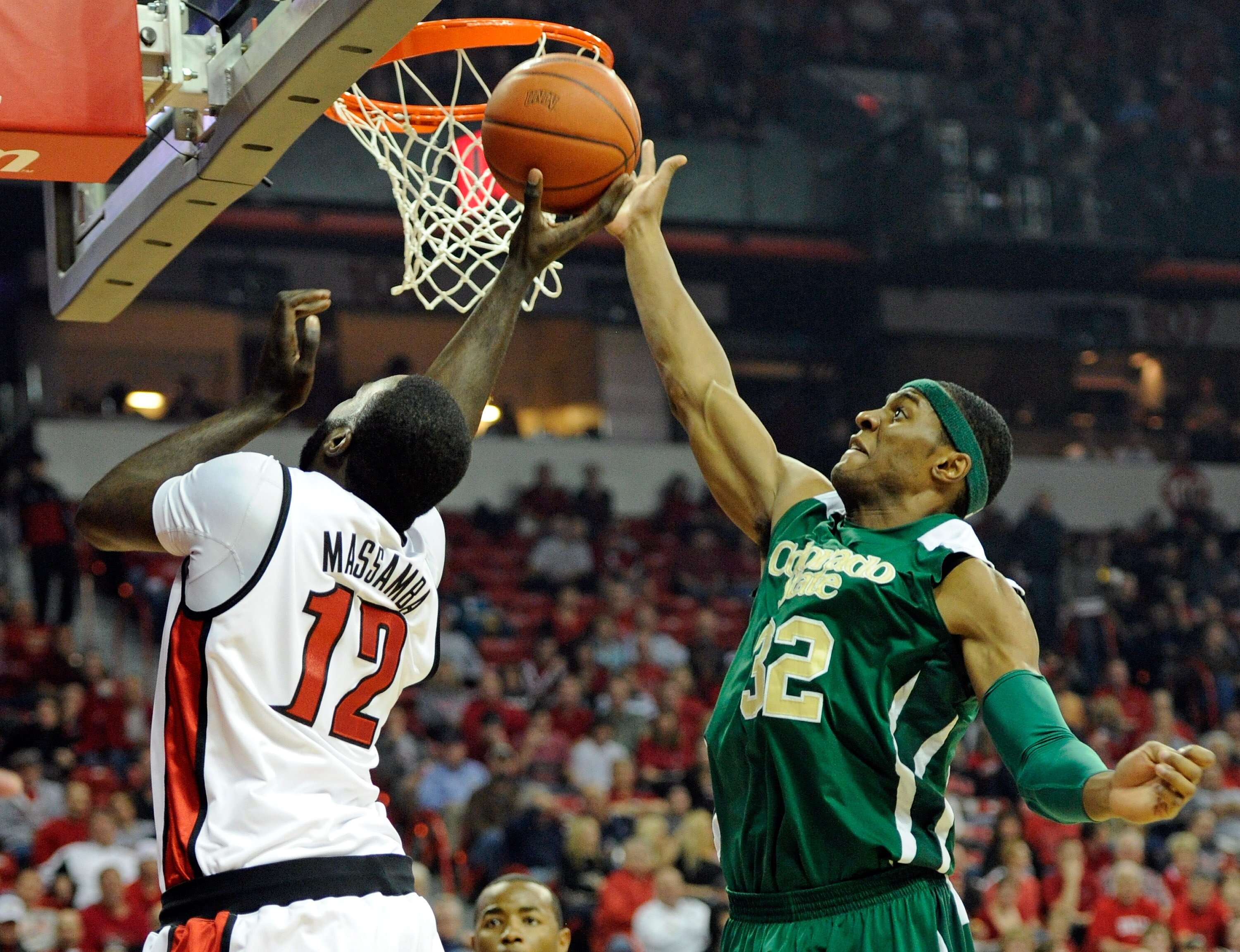 LAS VEGAS, NV - JANUARY 19:  Andy Ogide #32 of the Colorado State Rams blocks a shot by Brice Massamba #12 of the UNLV Rebels during their game at the Thomas & Mack Center January 19, 2011 in Las Vegas, Nevada. Colorado State won 78-63.  (Photo by Ethan M