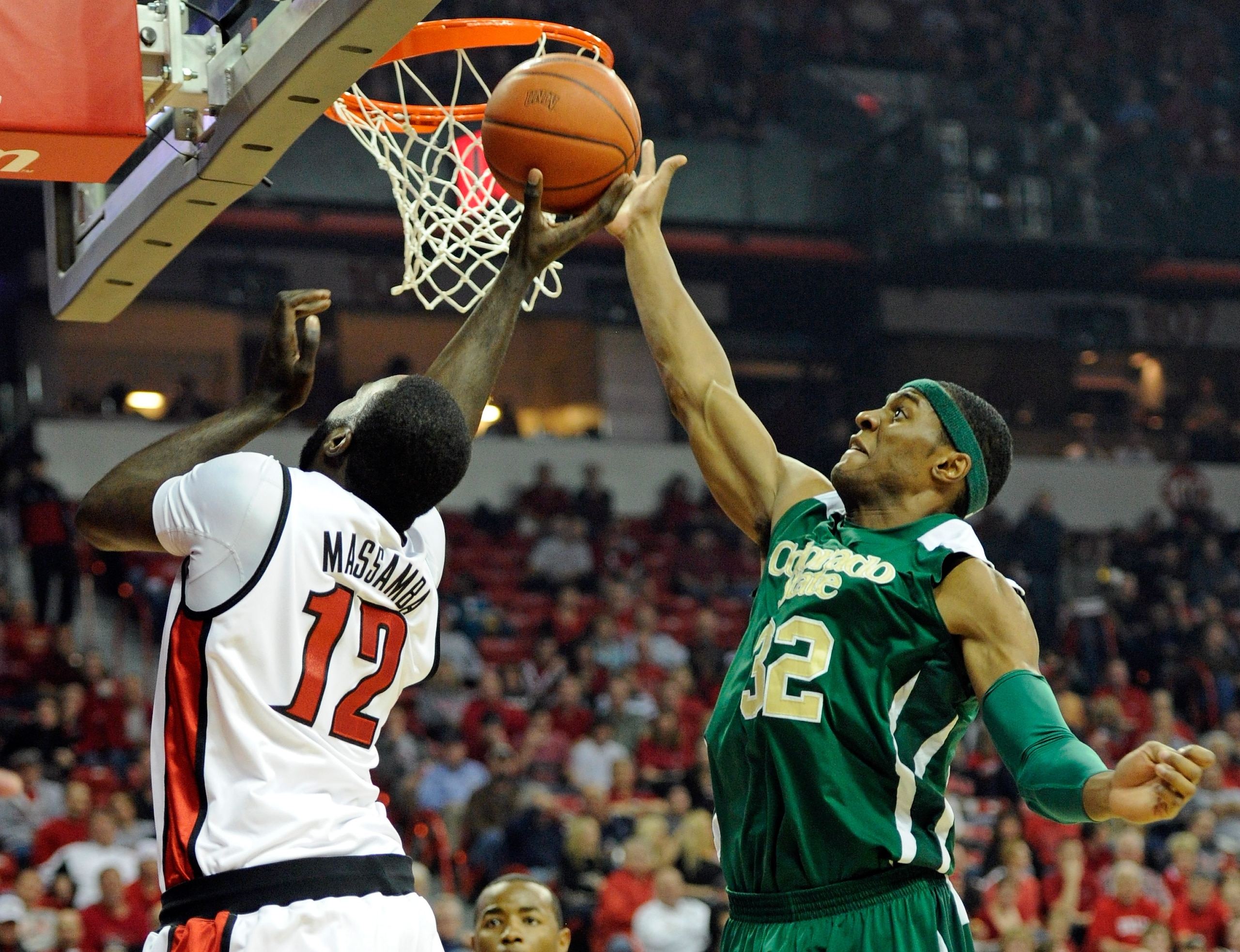 LAS VEGAS, NV - JANUARY 19:  Andy Ogide #32 of the Colorado State Rams blocks a shot by Brice Massamba #12 of the UNLV Rebels during their game at the Thomas & Mack Center January 19, 2011 in Las Vegas, Nevada. Colorado State won 78-63.  (Photo by Ethan M