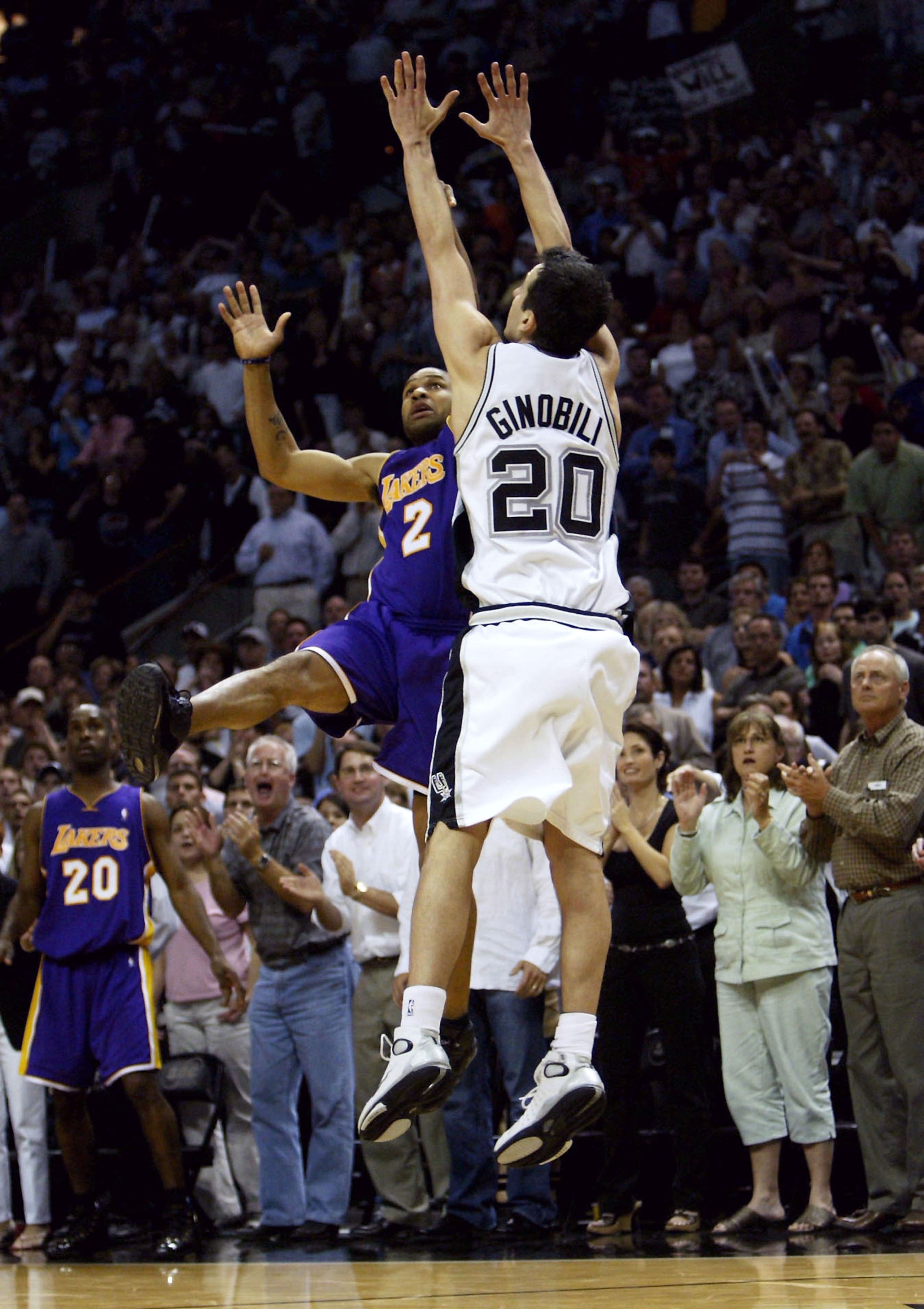 SAN ANTONIO - MAY 13: Derek Fisher #2 of the Los Angeles Lakers shoots and makes the game-winning shot at the buzzer over Emanuel Ginobili #20 of the San Antonio Spurs during game five of the Western Conference Semifinals during the 2004 NBA Playoffs on SAN ANTONIO - MAY 13: Derek Fisher #2 of the Los Angeles Lakers shoots and makes the game-winning shot at the buzzer over Emanuel Ginobili #20 of the San Antonio Spurs during game five of the Western Conference Semifinals during the 2004 NBA Playoffs on