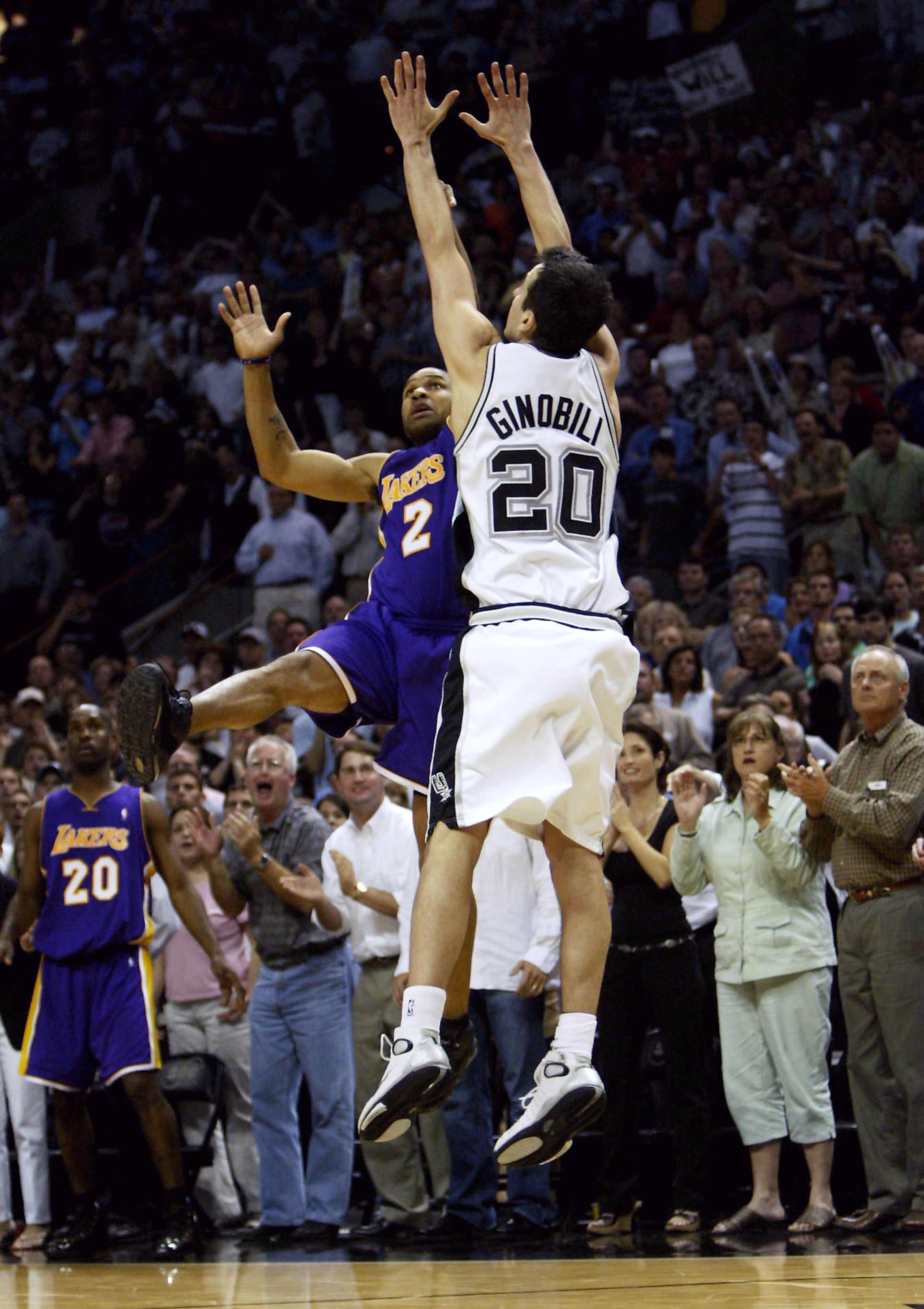 SAN ANTONIO - MAY 13:  Derek Fisher #2 of the Los Angeles Lakers shoots and makes the game-winning shot at the buzzer over Emanuel Ginobili #20 of the San Antonio Spurs during game five of the Western Conference Semifinals during the 2004 NBA Playoffs on