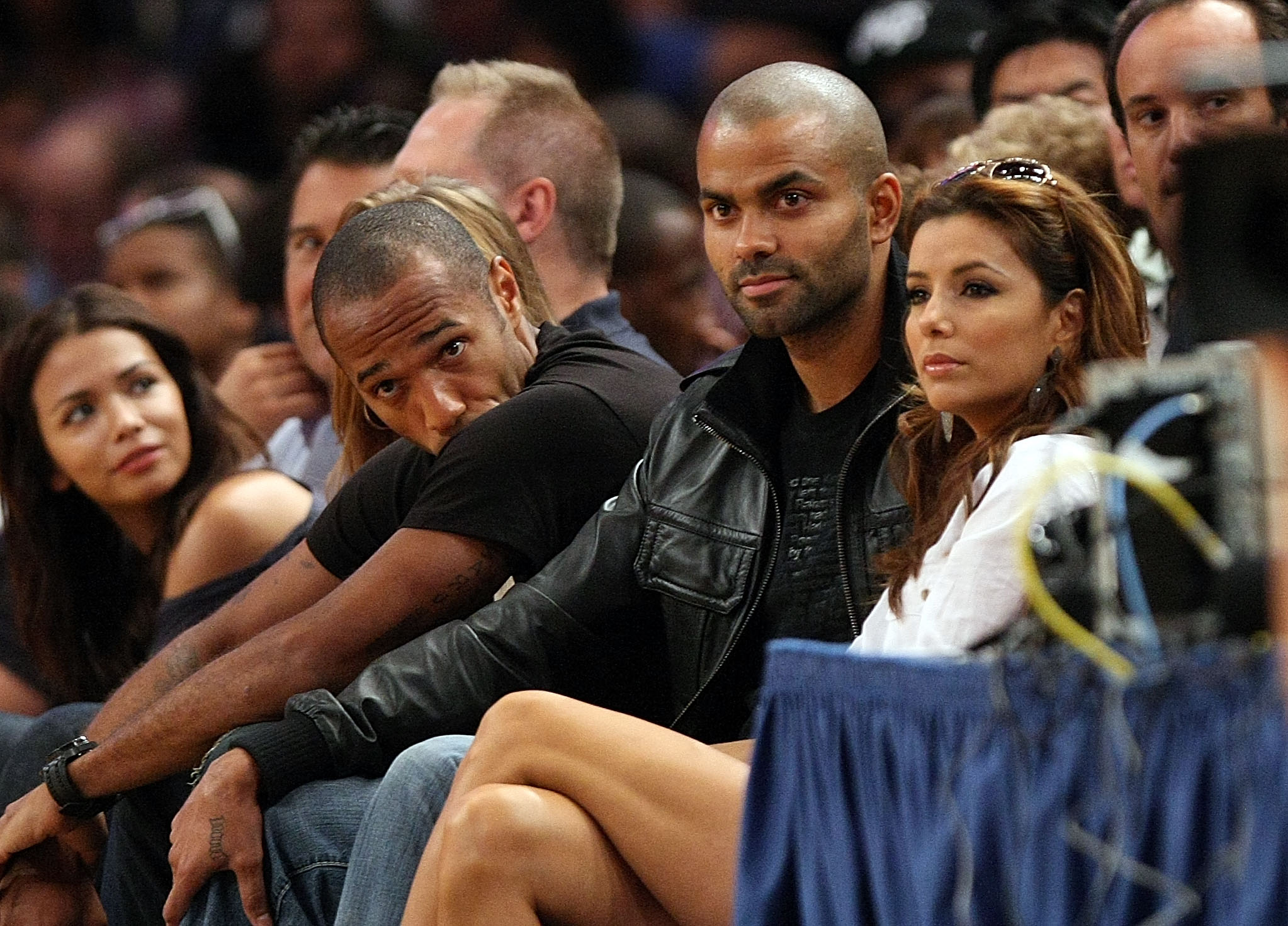 NEW YORK - AUGUST 15: Thierry Henry, Tony Parker and Eva Longoria Parker watch on during the United States and France exhibition game as part of the World Basketball Festival at Madison Square Garden on August 15, 2010 in New York City.  (Photo by Nick La