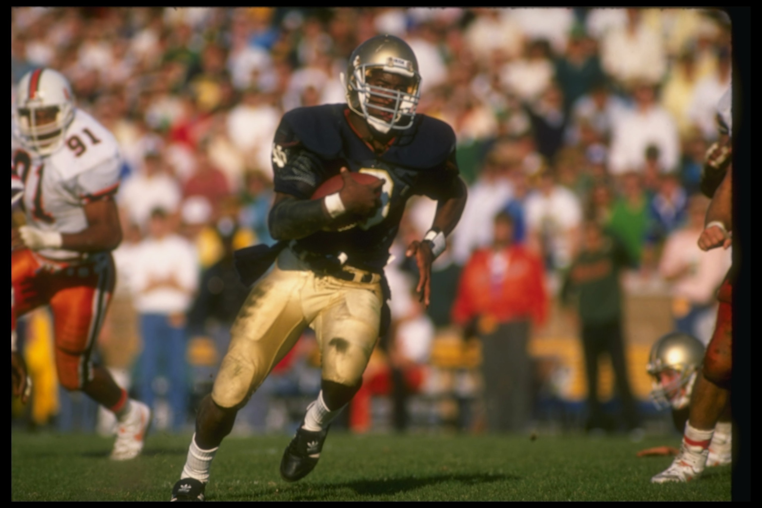 15 Oct 1988:  Tony Rice of the Notre Dame Fighting Irish runs with the ball during a game against the Miami Hurricanes at Notre Dame Stadium in South Bend, Indiana.  Notre Dame won the game, 31-30. Mandatory Credit: Jonathan Daniel  /Allsport