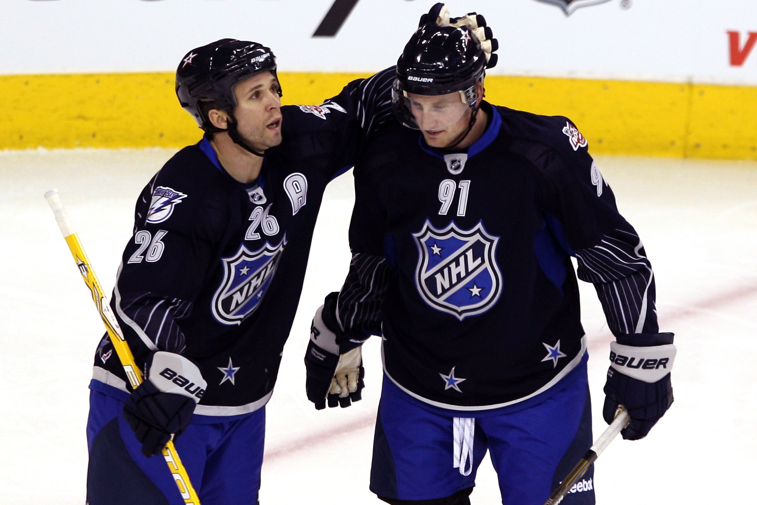 RALEIGH, NC - JANUARY 30:  Team Lidstrom players Steven Stamkos #91 of the Tampa Bay Lightning celebrates with Martin St. Louis #26 of the Tampa Bay Lightning after Stamkos scored a second period goal against Team Staal in the 58th NHL All-Star Game at RB