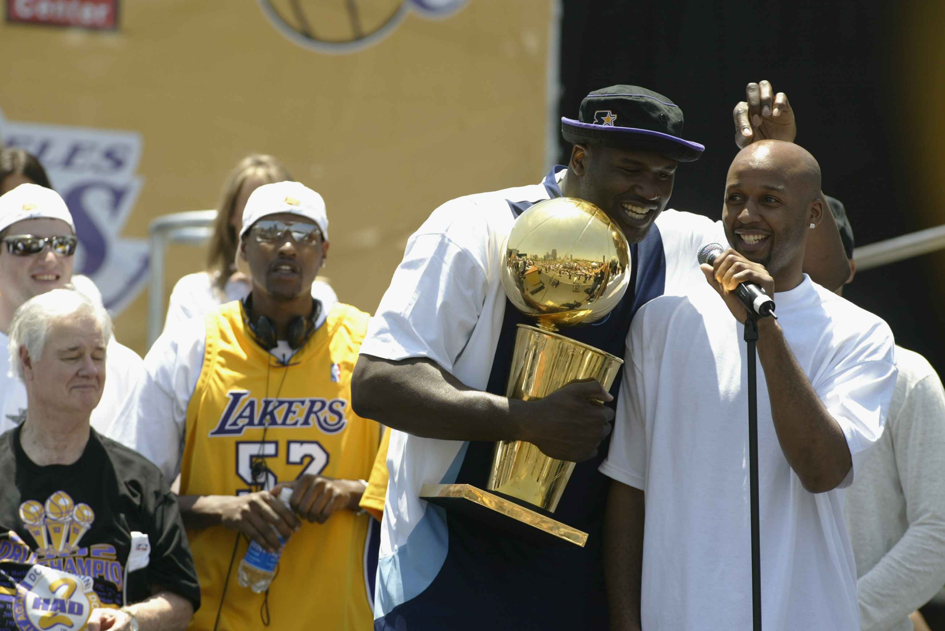 LOS ANGELES - JUNE 14: Brian Shaw #20 and Shaquille O'Neal #34 of the Los Angeles Lakers speak to the fans in front of the Staples Center following the victory parade on June 14, 2002 at Staples Center in Los Angeles, California.  The Lakers won their thi