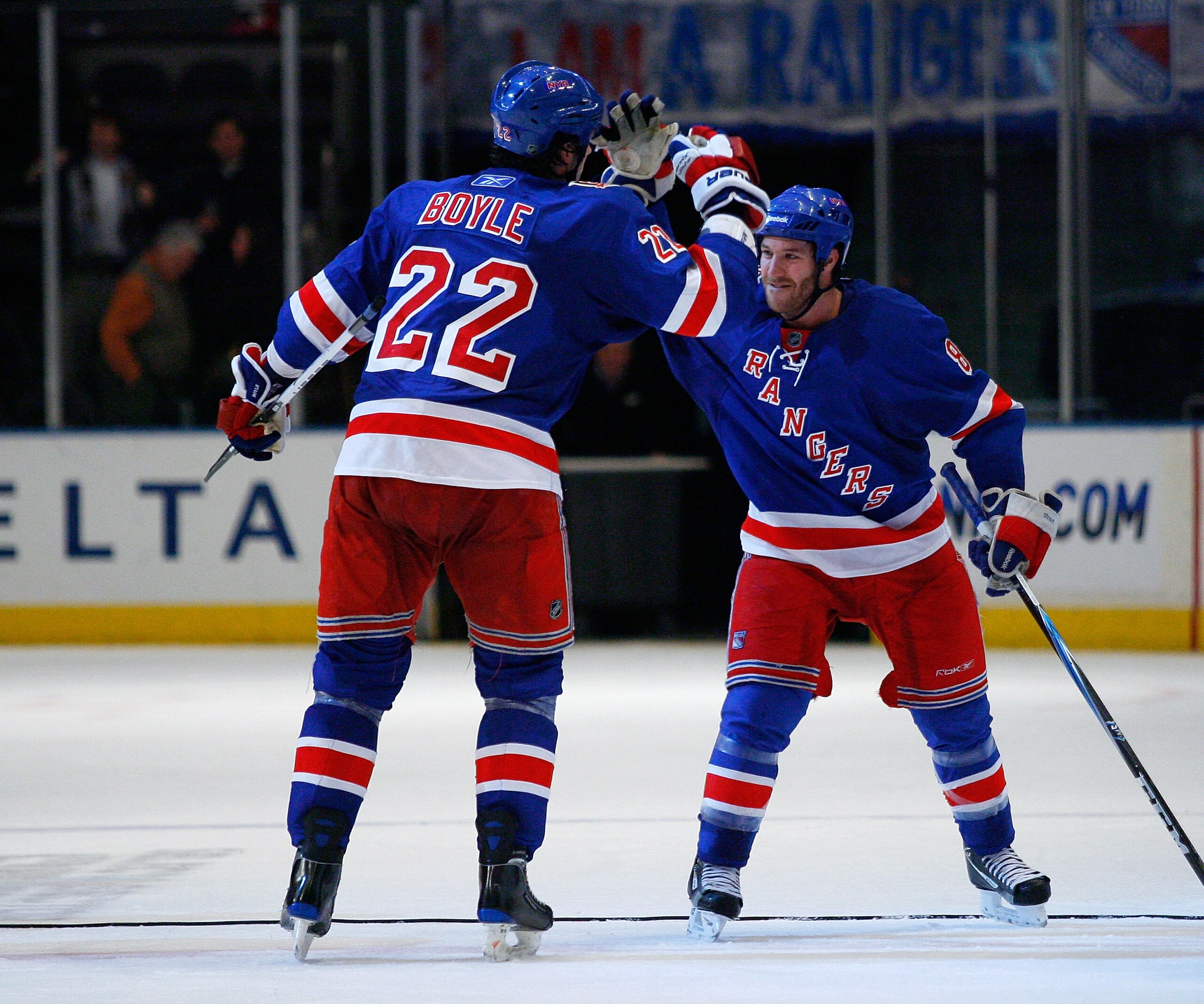 NEW YORK , NY - JANUARY 13: Brian Boyle #22 and Brandon Prust #8 of the New York Rangers high five each opther after the Rangers shutout the Vancouver Canucks at Madison Square Garden on January 13, 2011 in New York City. (Photo by Andy Marlin/Getty Image