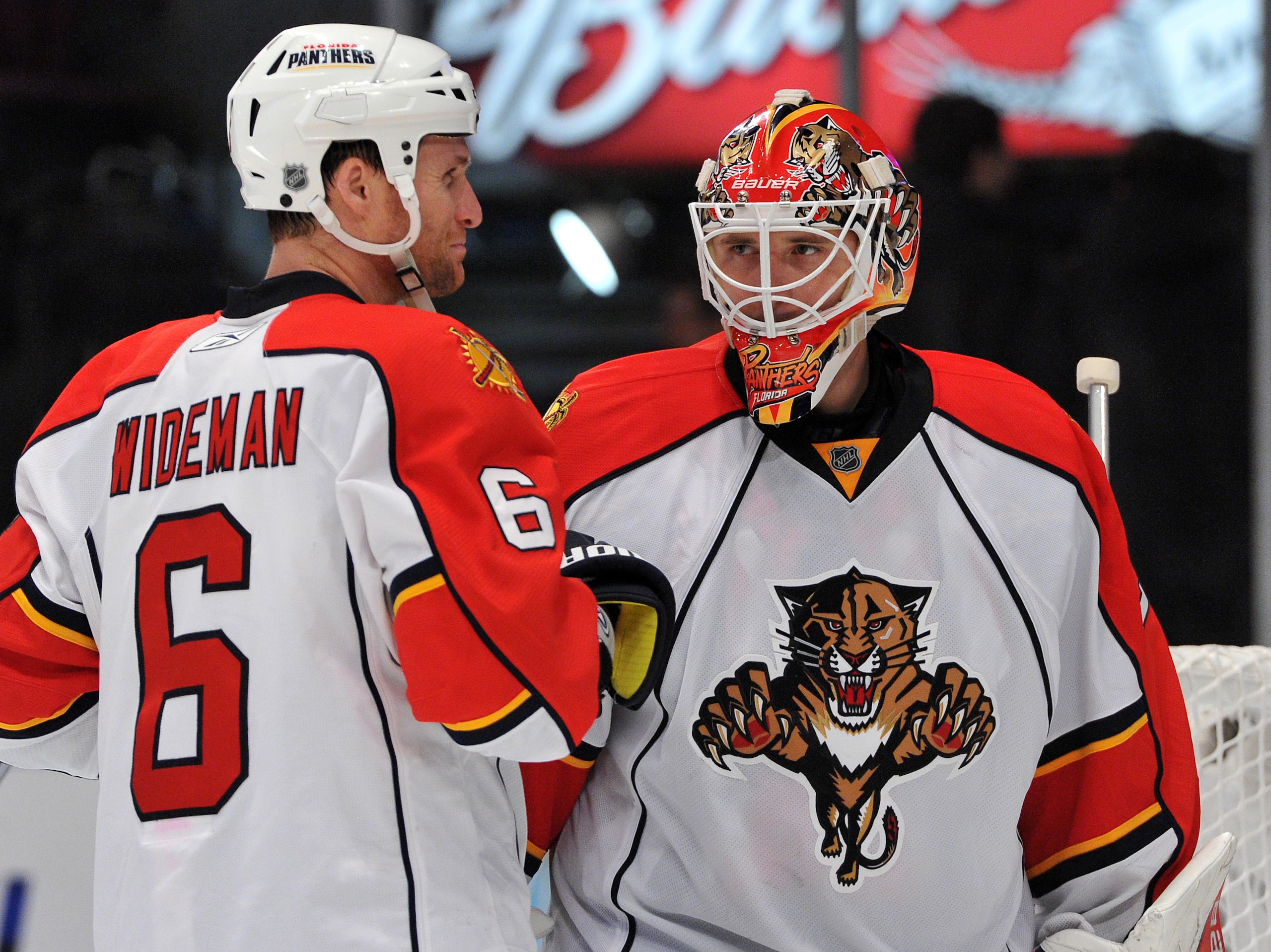 NEW YORK, NY - JANUARY 25: Tomas Vokoun #29 of the Florida Panthers is congratulated by Dennis Wideman #6 after defeating the New York Rangers 4-3 at Madison Square Garden on January 25, 2011 in New York City. The Panthers defeated the 4-3. (Photo by Chri