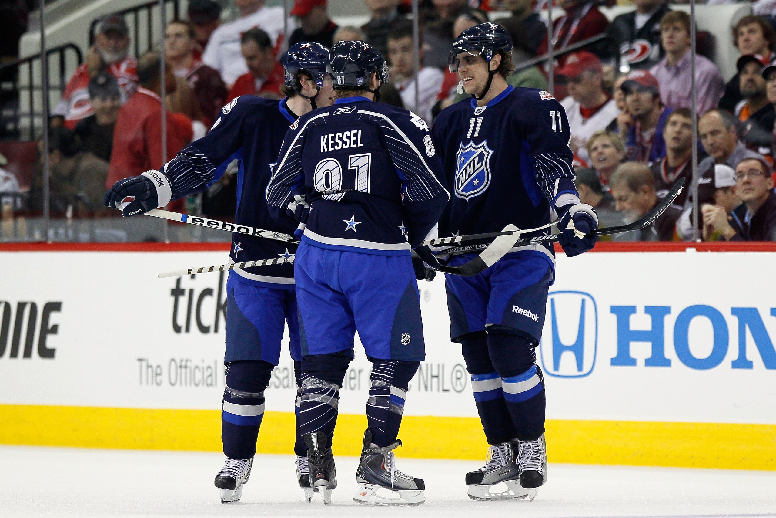 RALEIGH, NC - JANUARY 30: Team Lidstrom players including Phil Kessel #81 of the Toronto Maple Leafs and Anze Kopitar #11 of the Los Angeles Kings reacts against Team Staal in the 58th NHL All-Star Game at RBC Center on January 30, 2011 in Raleigh, North