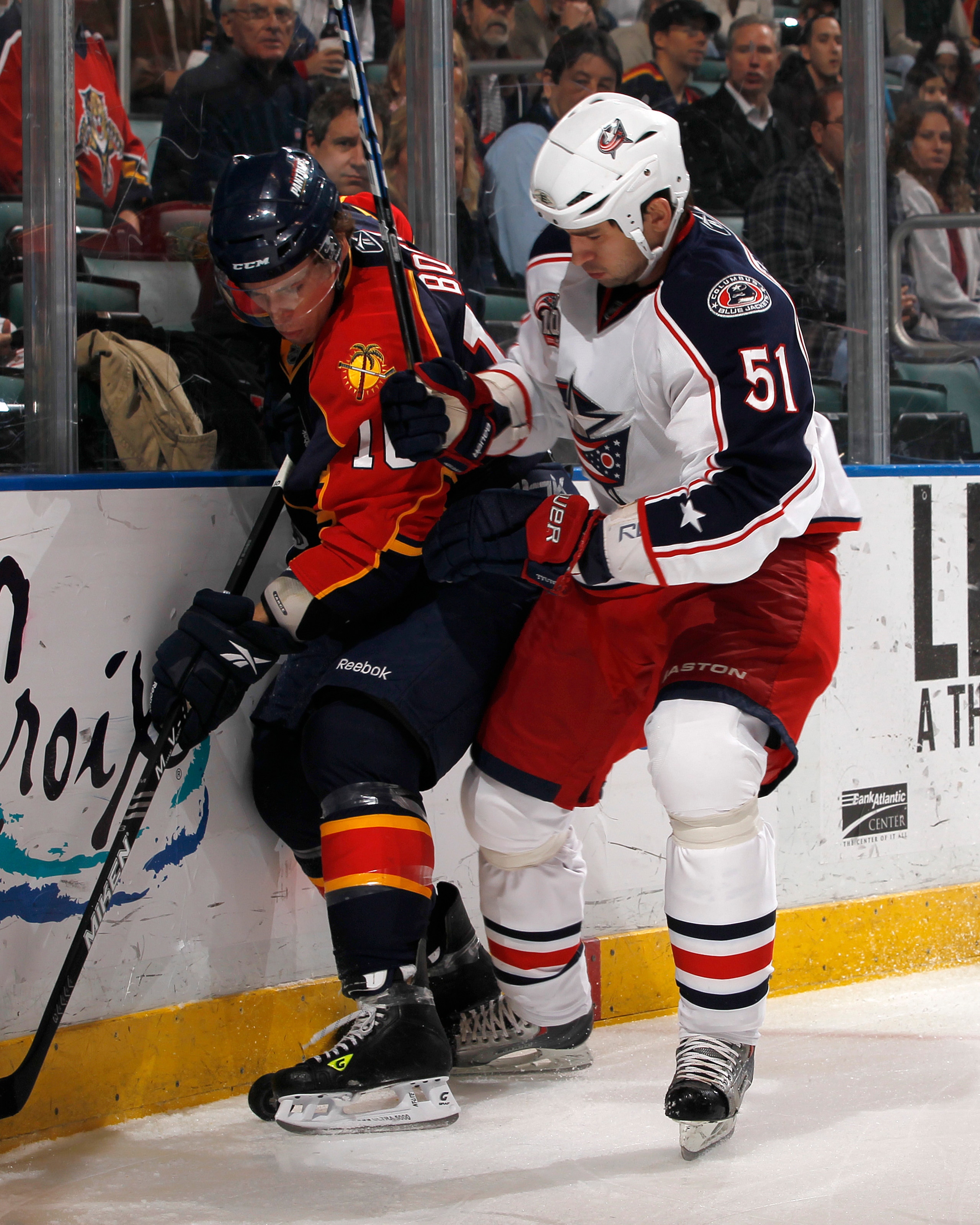 SUNRISE, FL - JANUARY 19: David Booth #10 of the Florida Panthers is checked by Fedor Tyutin #51 of the Columbus Blue Jackets on January 19, 2011 at the BankAtlantic Center in Sunrise, Florida. (Photo by Joel Auerbach/Getty Images)