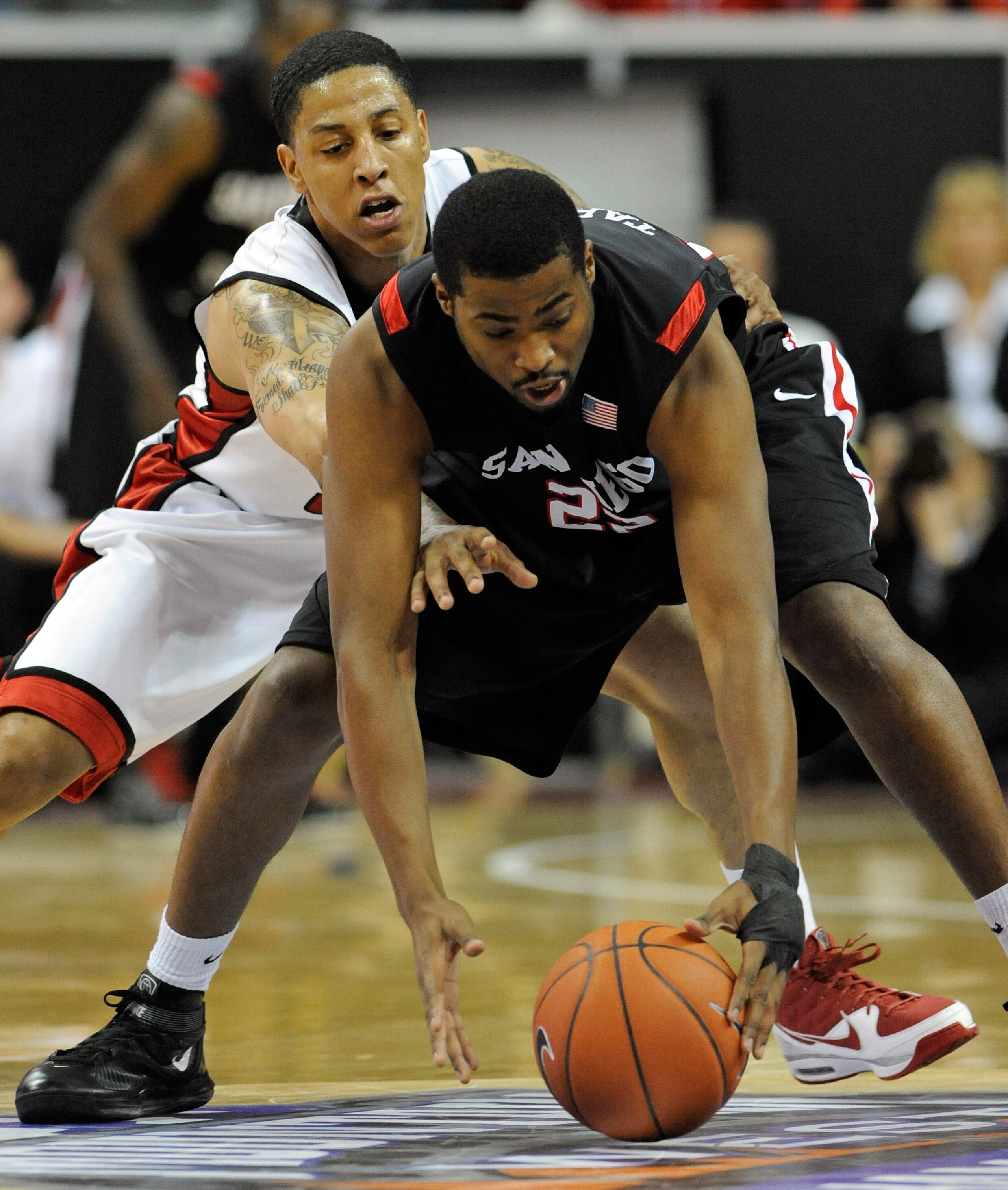 LAS VEGAS - MARCH 13: Tre'Von Willis #33 of the UNLV Rebels tries to steal the ball from Chase Tapley #22 of the San Diego State Aztecs during the championship game of the Conoco Mountain West Conference Basketball tournament at the Thomas & Mack Center LAS VEGAS - MARCH 13: Tre'Von Willis #33 of the UNLV Rebels tries to steal the ball from Chase Tapley #22 of the San Diego State Aztecs during the championship game of the Conoco Mountain West Conference Basketball tournament at the Thomas & Mack Center