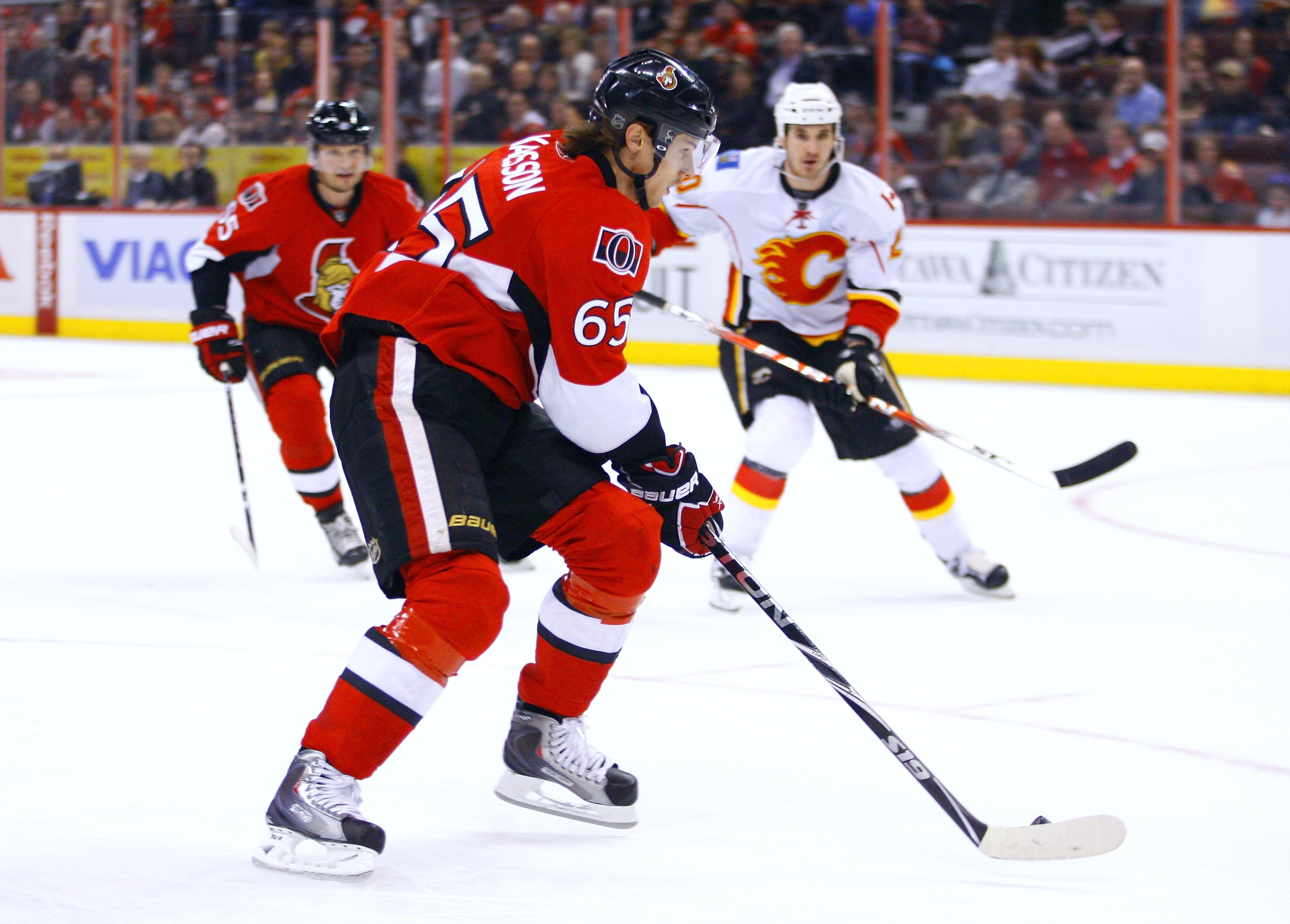 OTTAWA, ON - JANUARY 14:  Erik Karlsson #65 of the Ottawa Senators turns back into his zone with the puck in a game against the Calgary Flames at Scotiabank Place on January 14, 2011 in Ottawa, Canada. The Flames won 3-2. (Photo by Phillip MacCallum/Getty