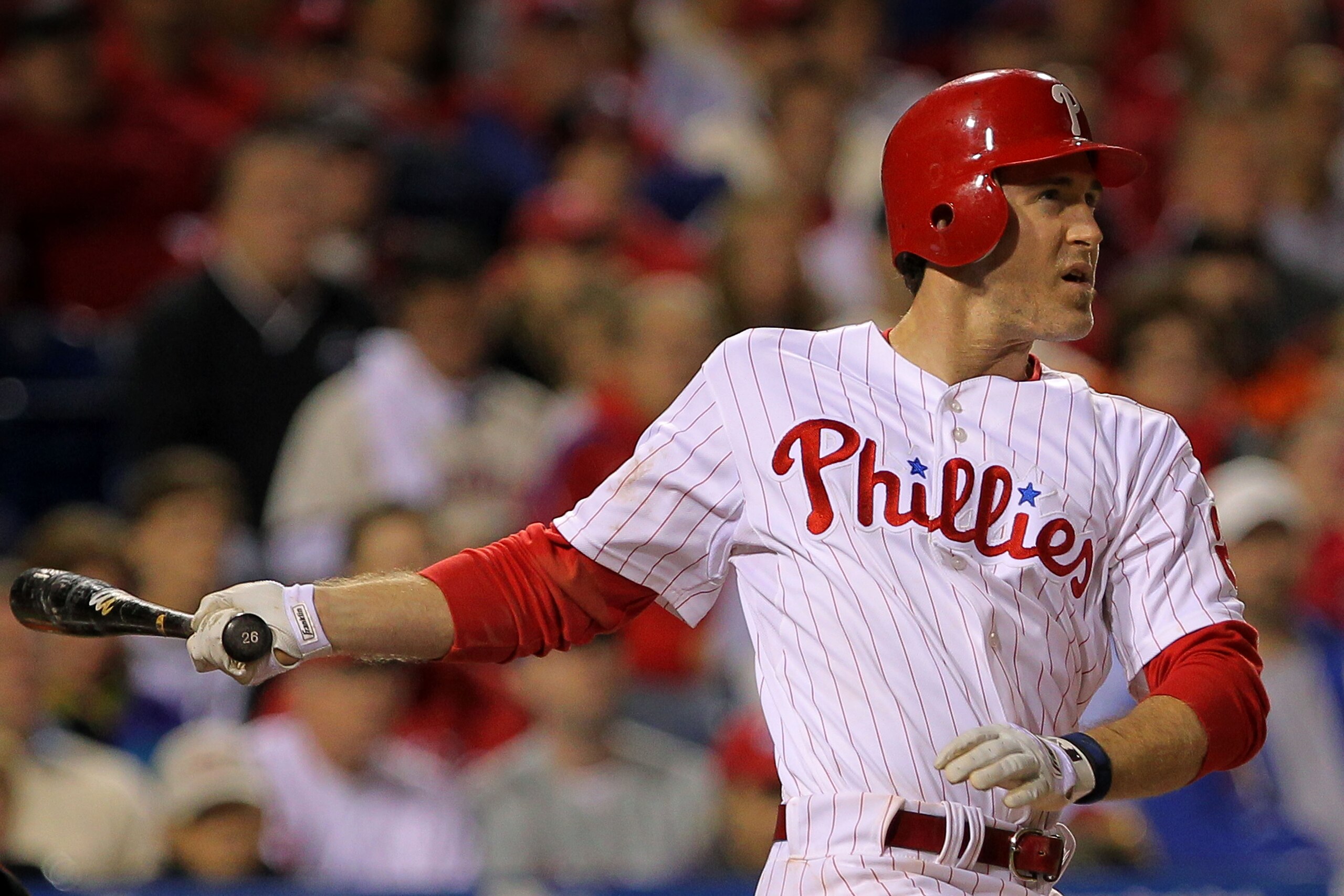 PHILADELPHIA - OCTOBER 17:  Chase Utley #26 of the Philadelphia Phillies connects for a long fly ball out to advance the runners against the San Francisco Giants in Game Two of the NLCS during the 2010 MLB Playoffs at Citizens Bank Park on October 17, 201