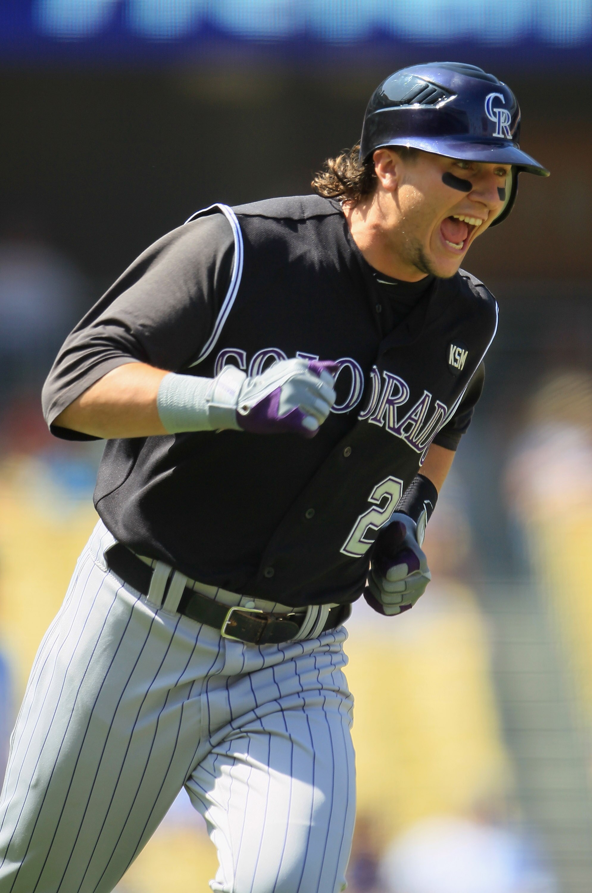 LOS ANGELES, CA - SEPTEMBER 18:  Troy Tulowitzki #2 of the Colorado Rockies celebrates as he rounds first base after hitting a two-run home run against the Los Angeles Dodgers in the first inning at Dodger Stadium on September 18, 2010 in Los Angeles, Cal