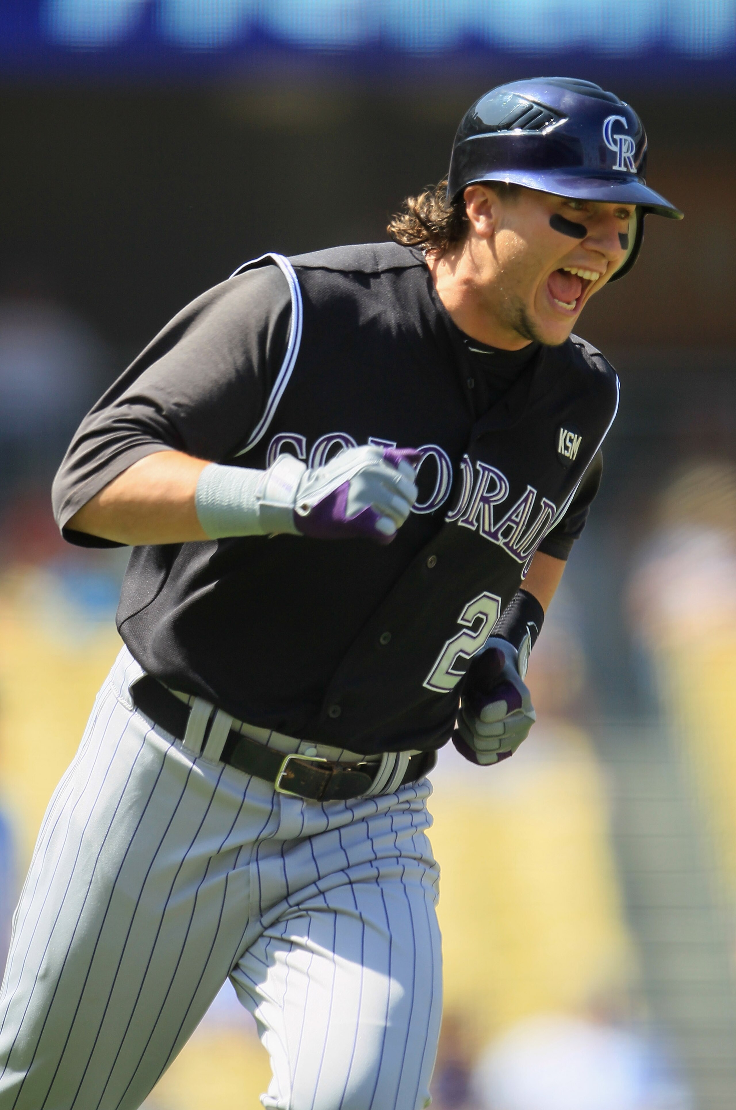 LOS ANGELES, CA - SEPTEMBER 18:  Troy Tulowitzki #2 of the Colorado Rockies celebrates as he rounds first base after hitting a two-run home run against the Los Angeles Dodgers in the first inning at Dodger Stadium on September 18, 2010 in Los Angeles, Cal