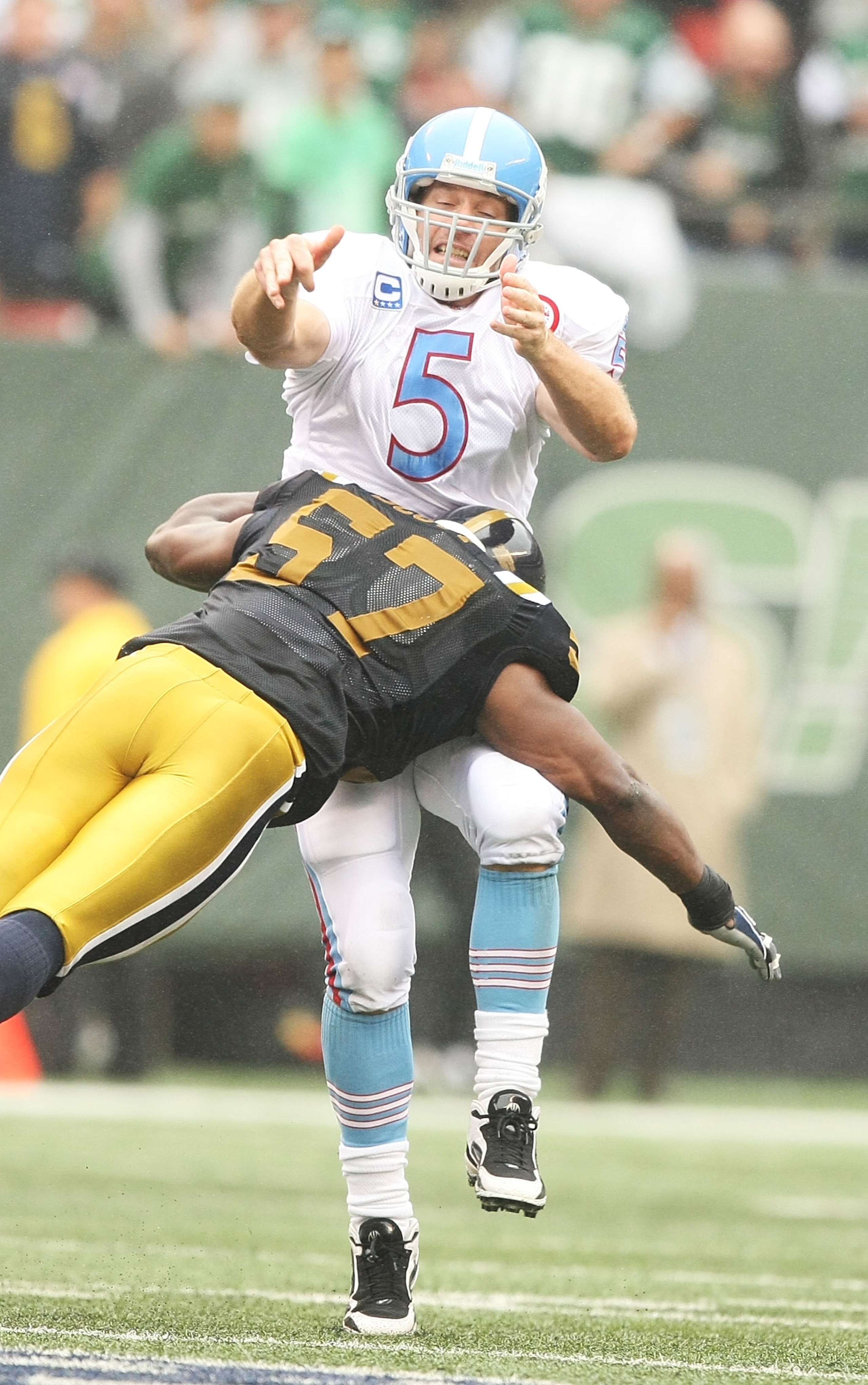 EAST RUTHERFORD, NJ - SEPTEMBER 27:  Bart Scott #57 of The New York Jets hits Kerry Collins #5 of The Tennessee Titans as he passes during their game on September 27, 2009 at Giants Stadium in East Rutherford, New Jersey.  (Photo by Al Bello/Getty Images)