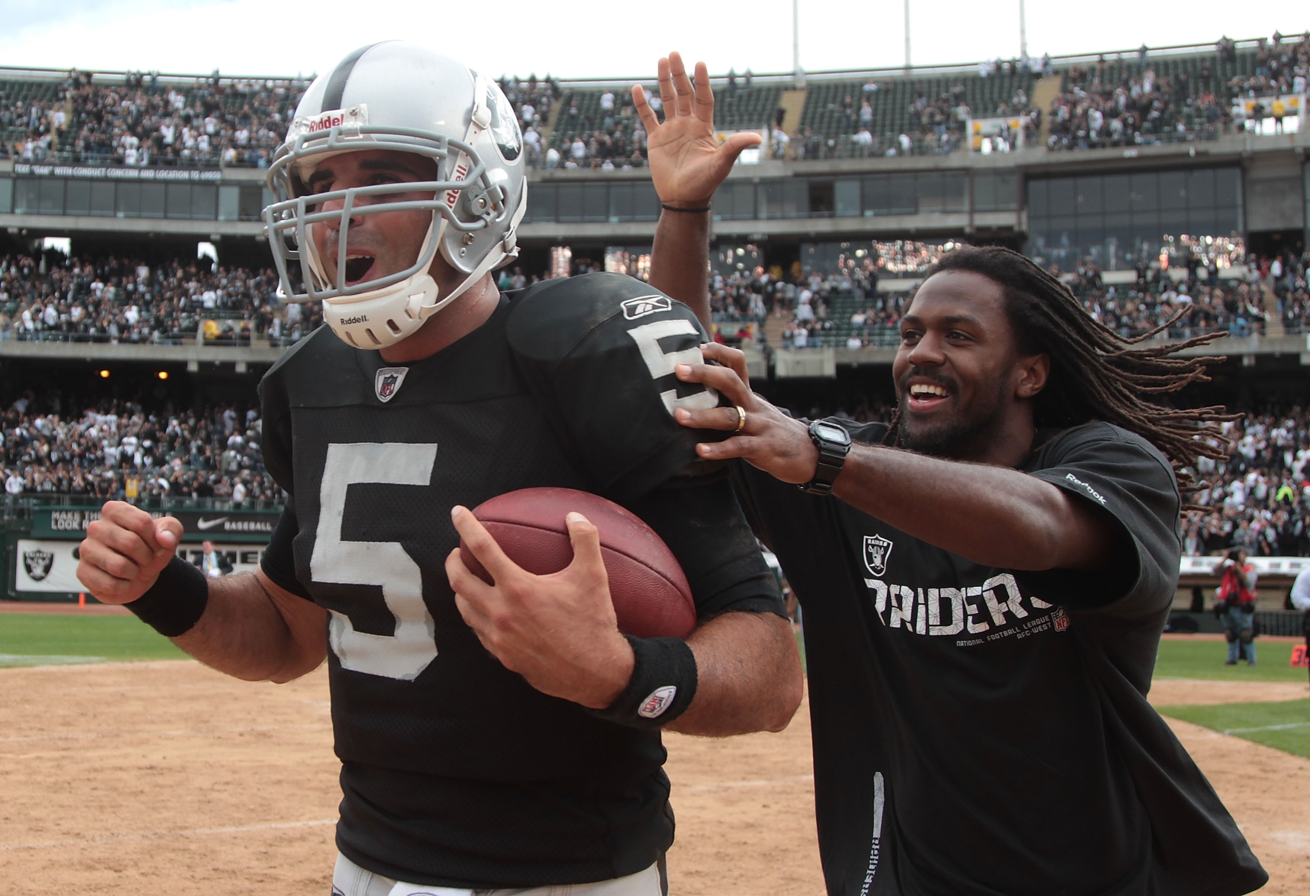 OAKLAND, CA - SEPTEMBER 19:  Bruce Gradkowski #5 of the Oakland Raiders celebrates after defeating the St. Louis Rams during an NFL game at Oakland-Alameda County Coliseum on September 19, 2010 in Oakland, California.  (Photo by Jed Jacobsohn/Getty Images