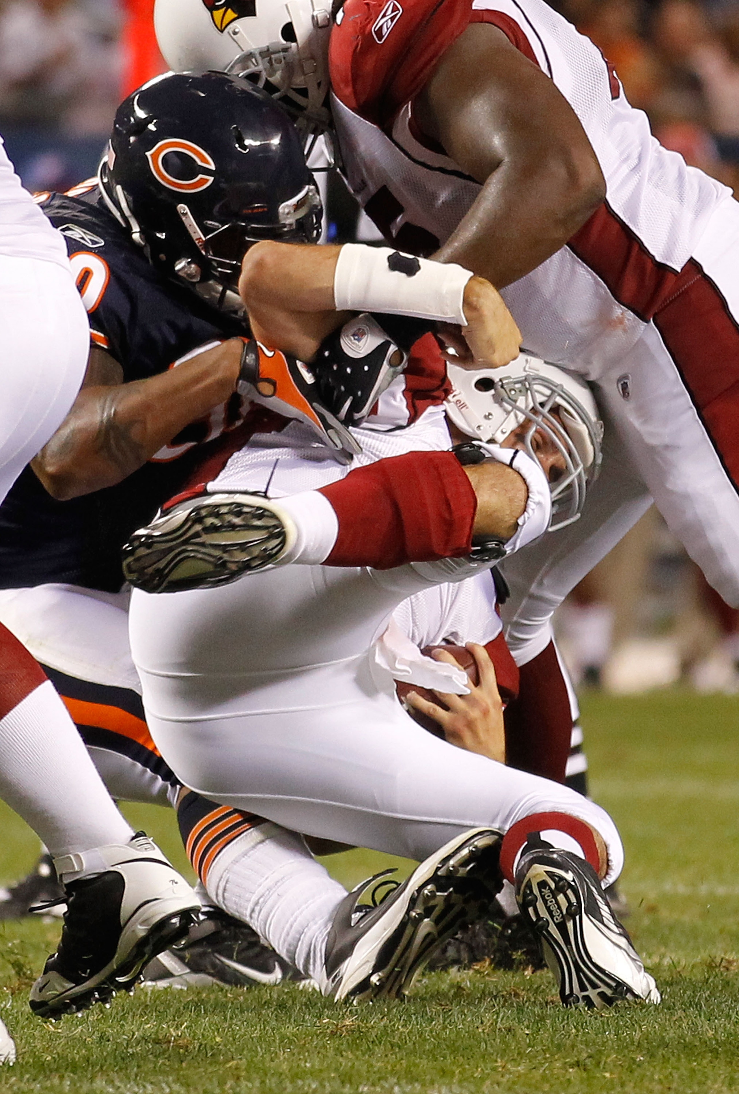 CHICAGO - AUGUST 28: Julius Peppers #90 of the Chicago Bears sacks Matt Leinart #7 of the Arizona Cardinals during a preseason game at Soldier Field on August 28, 2010 in Chicago, Illinois. The Cardinals defeated the Bears 14-9. (Photo by Jonathan Daniel/