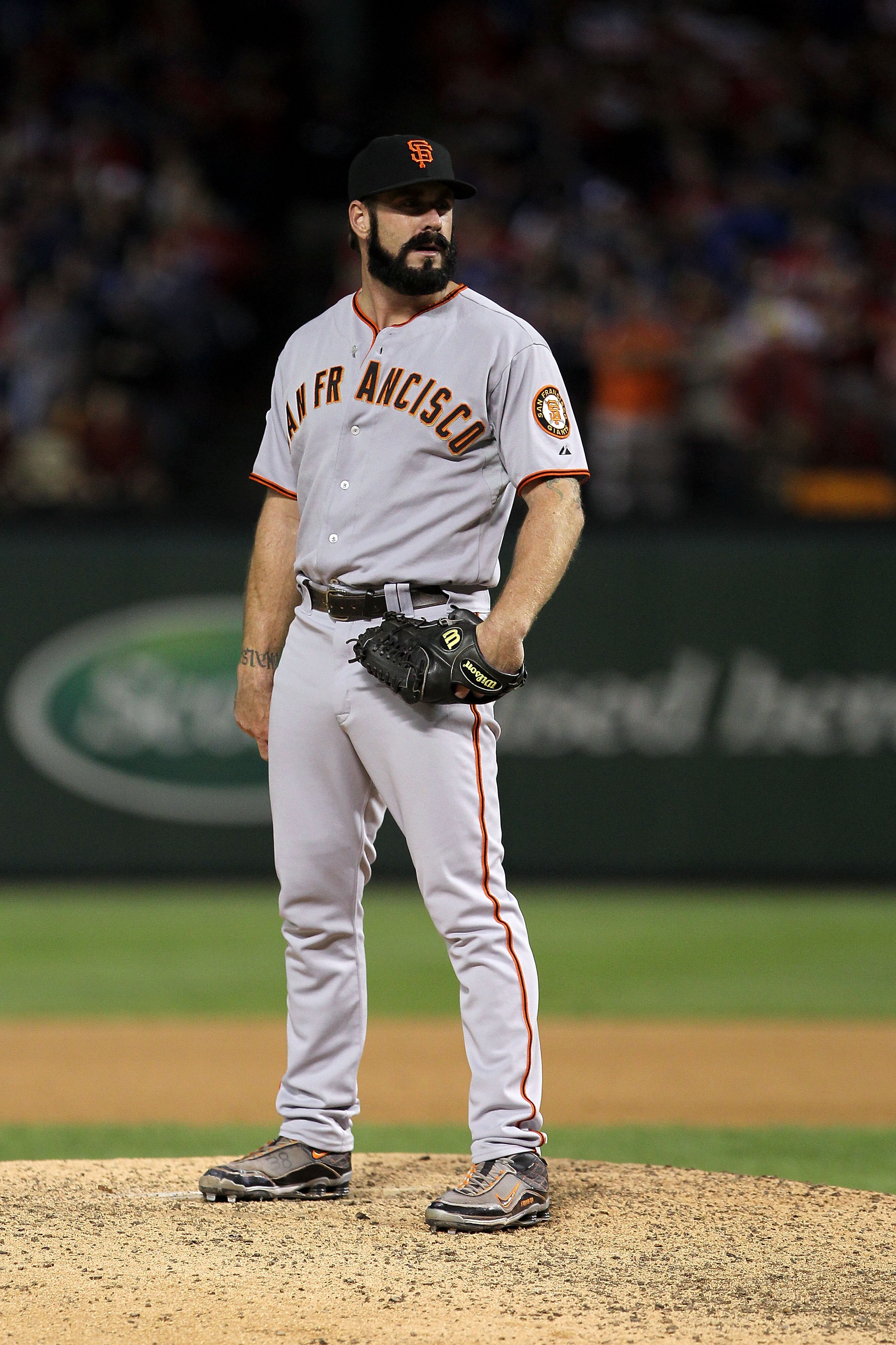 ARLINGTON, TX - NOVEMBER 01:  Closing pitcher Brian Wilson #38 of the San Francisco Giants gets set to throw a pitch against the Texas Rangers in Game Five of the 2010 MLB World Series at Rangers Ballpark in Arlington on November 1, 2010 in Arlington, Tex