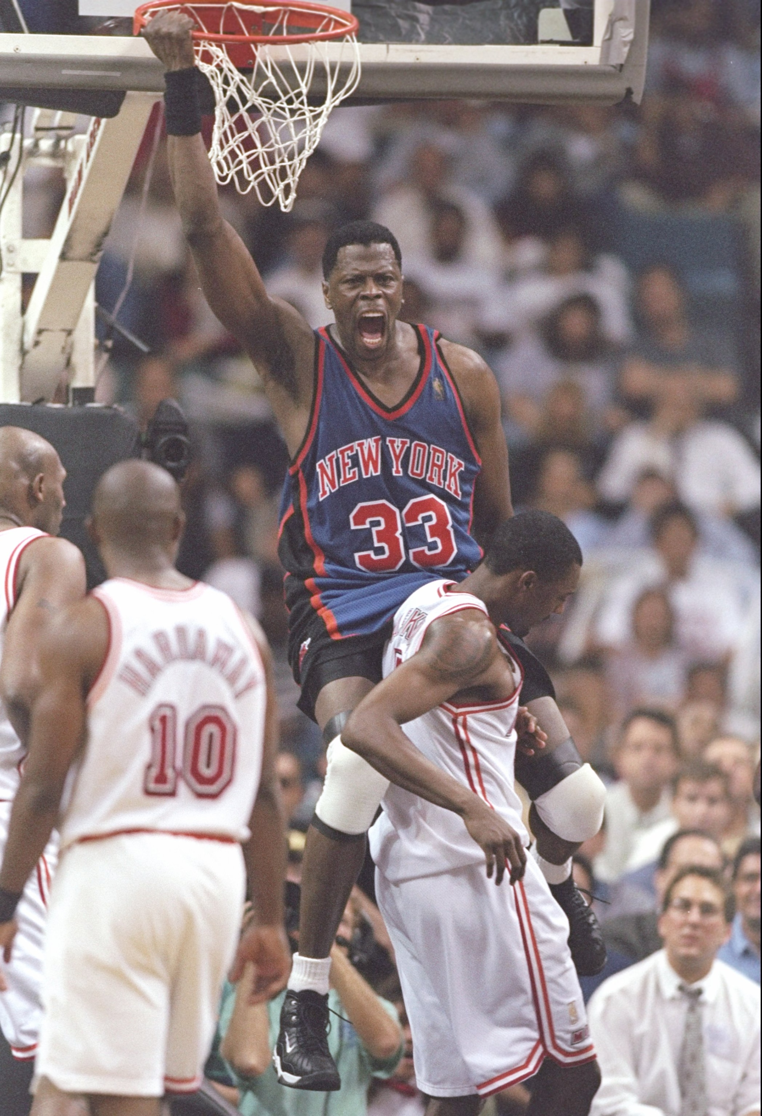 7 May 1997:  Center Patrick Ewing of the New York Knicks slam dunks the ball as guard Tim Hardaway of the Miami Heat watches during a playoff game at the Miami Arena in Miami, Florida.  The Knicks won the game 88-79. Mandatory Credit: Andy Lyons  /Allspor