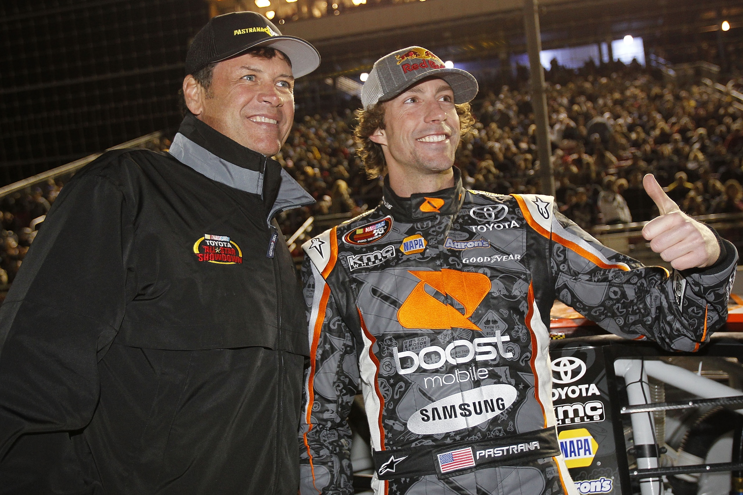 IRWINDALE, CA - JANUARY 29:  Team owner Michael Waltrip (L) and Travis Pastrana (R), driver of the #99 Boost Mobile Toyota, talk on the grid before the NASCAR Toyota All-Star Showdown at Toyota Speedway at Irwindale on January 29, 2011 in Irwindale, Calif
