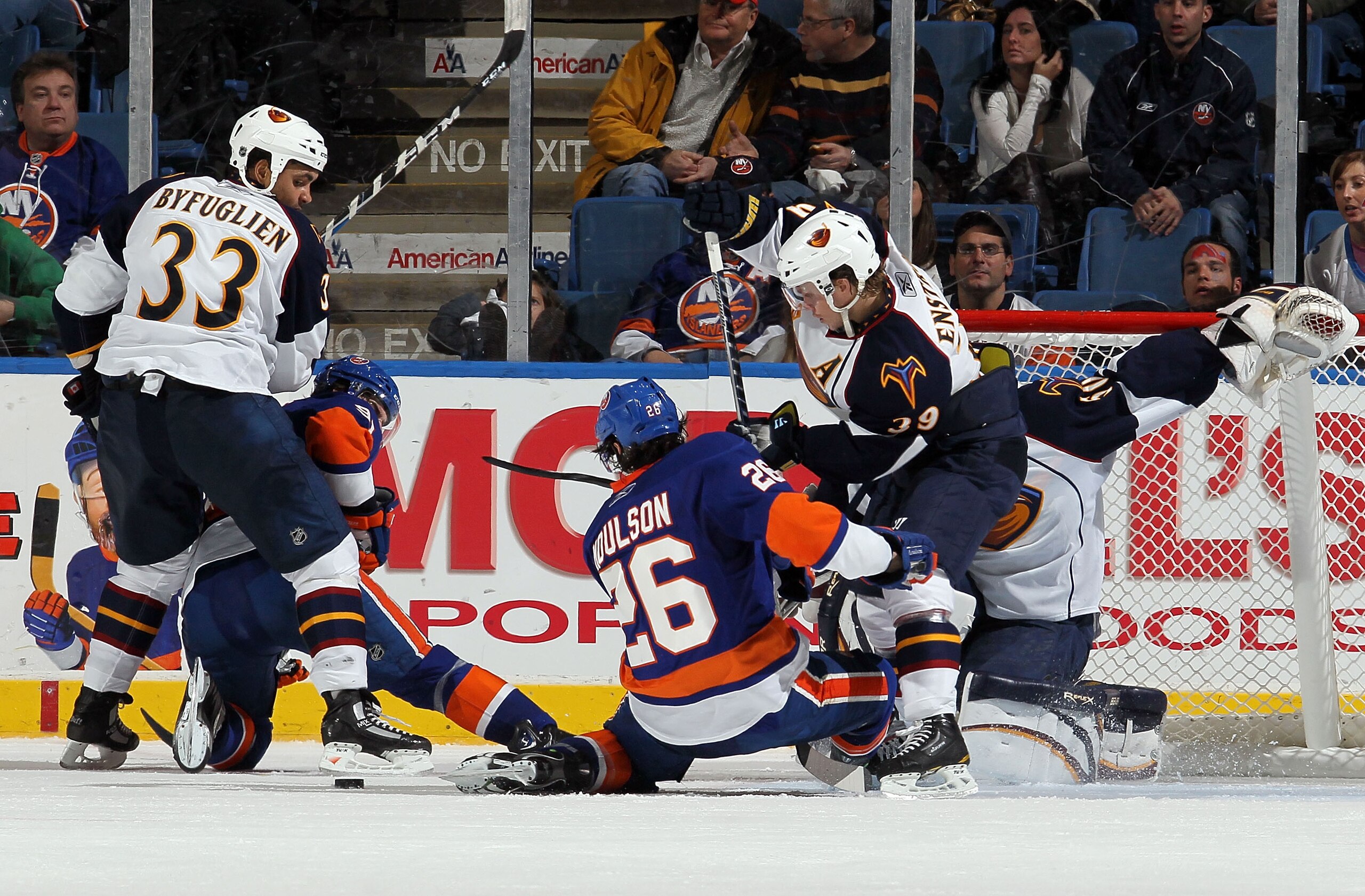 UNIONDALE, NY - DECEMBER 11:  Dustin Byfuglien #33 and Tobias Enstrom #39 of the Atlanta Thrashers defend against John Tavares #91 and Matt Moulson #26 of the New York Islanders on December 11, 2010 at Nassau Coliseum in Uniondale, New York. The Thrashers