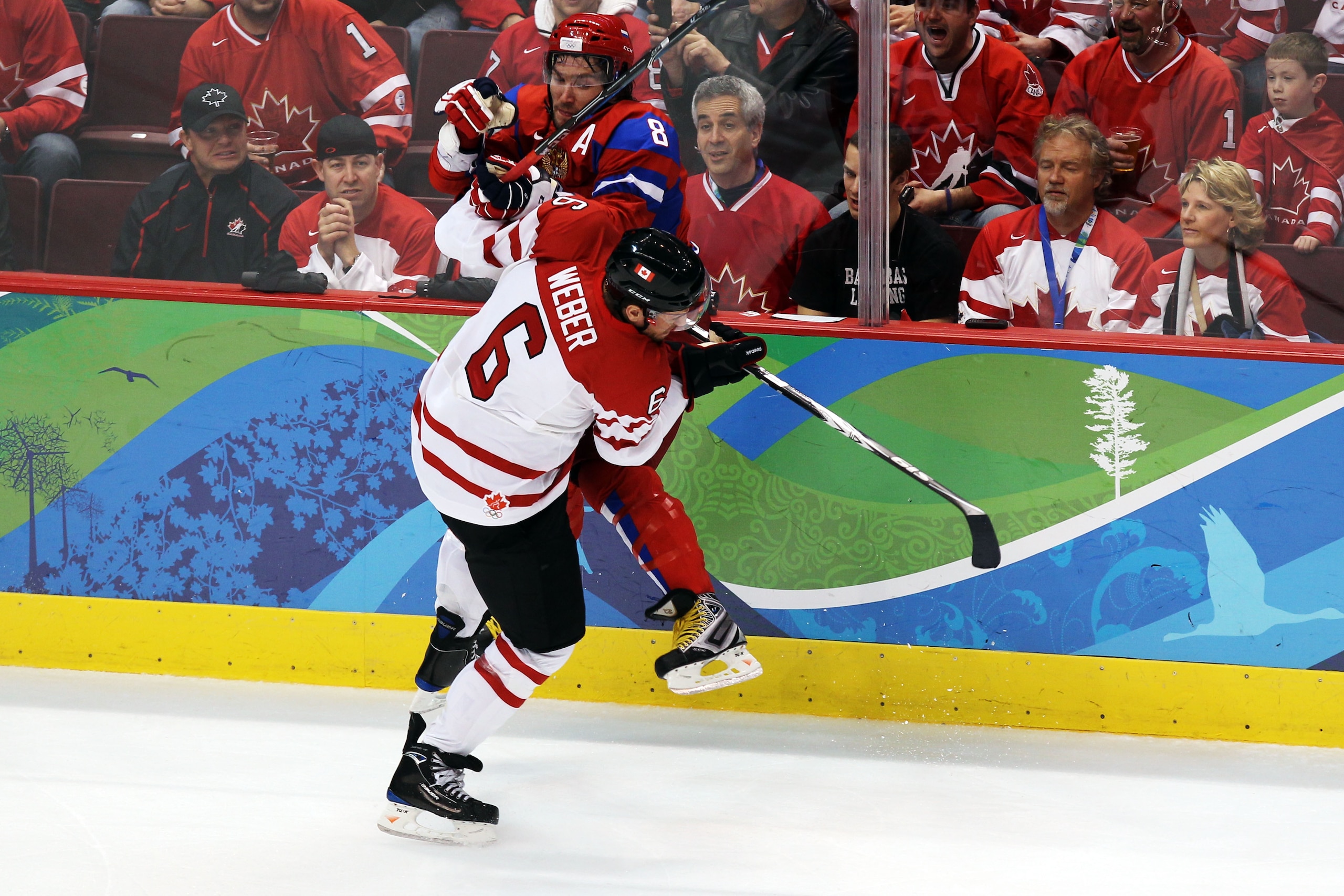 VANCOUVER, BC - FEBRUARY 24:  Shea Weber #6 of Canada collides with Alexander Ovechkin #8 of Russia during the ice hockey men's quarter final game between Russia and Canada on day 13 of the Vancouver 2010 Winter Olympics at Canada Hockey Place on February