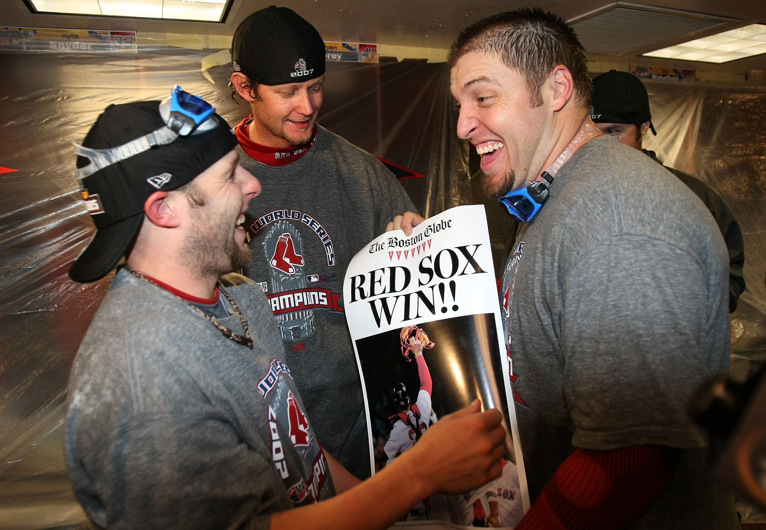 DENVER - OCTOBER 28:  (L-R) Dustin Pedroia, Matt Clement and Doug Mirabelli of the Boston Red Sox celebrate in the locker room after winning Game Four by a score of 4-3 to win the 2007 Major League Baseball World Series in a four game sweep of the Colorad