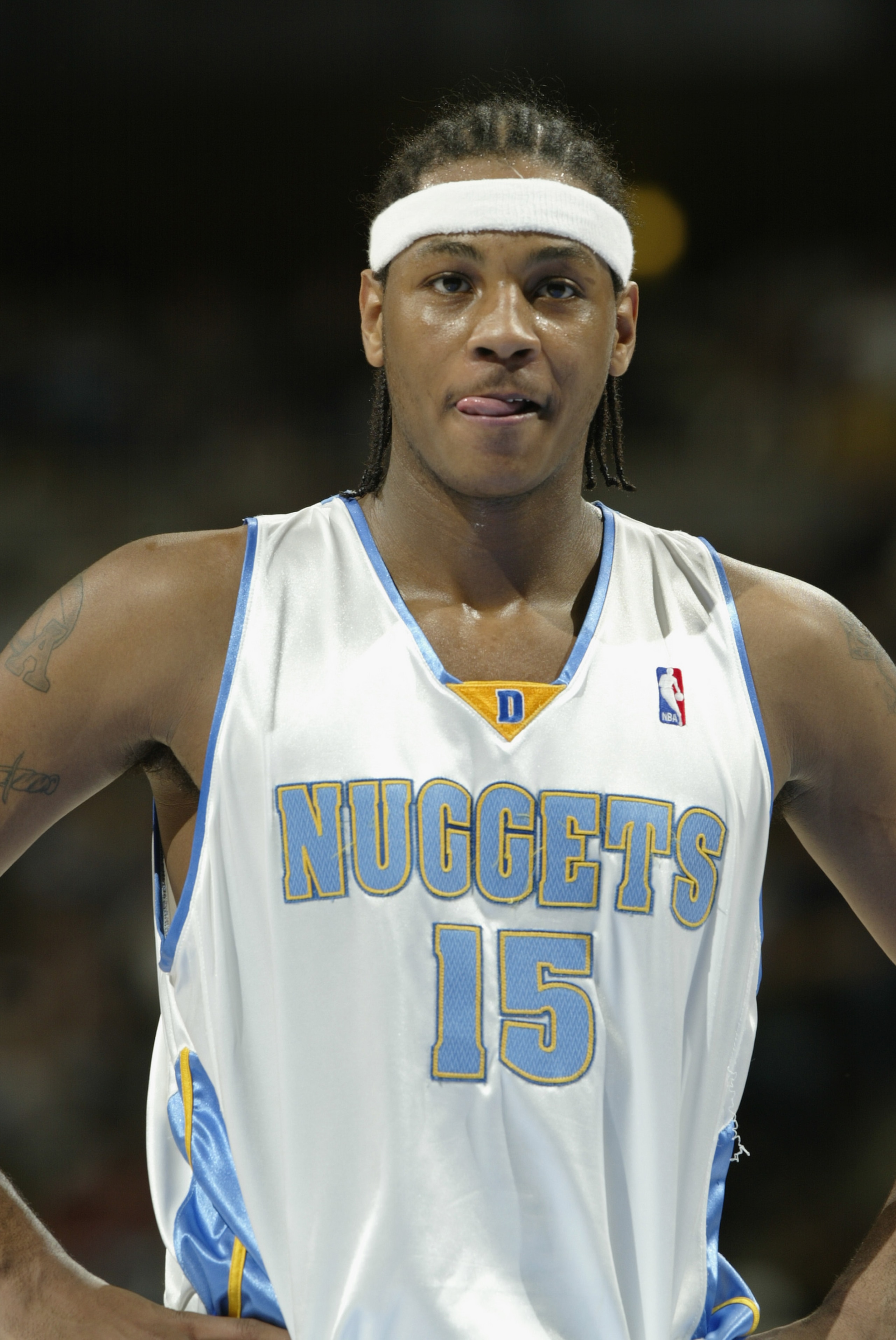 DENVER - DECEMBER 22: Carmelo Anthony #15 of the Denver Nuggets looks on against the Memphis Grizzlies during the game on December 22, 2003 at the Pepsi Center in Denver, Colorado. The Nuggets won 106-99. NOTE TO USER: User expressly acknowledges and DENVER - DECEMBER 22: Carmelo Anthony #15 of the Denver Nuggets looks on against the Memphis Grizzlies during the game on December 22, 2003 at the Pepsi Center in Denver, Colorado. The Nuggets won 106-99. NOTE TO USER: User expressly acknowledges and