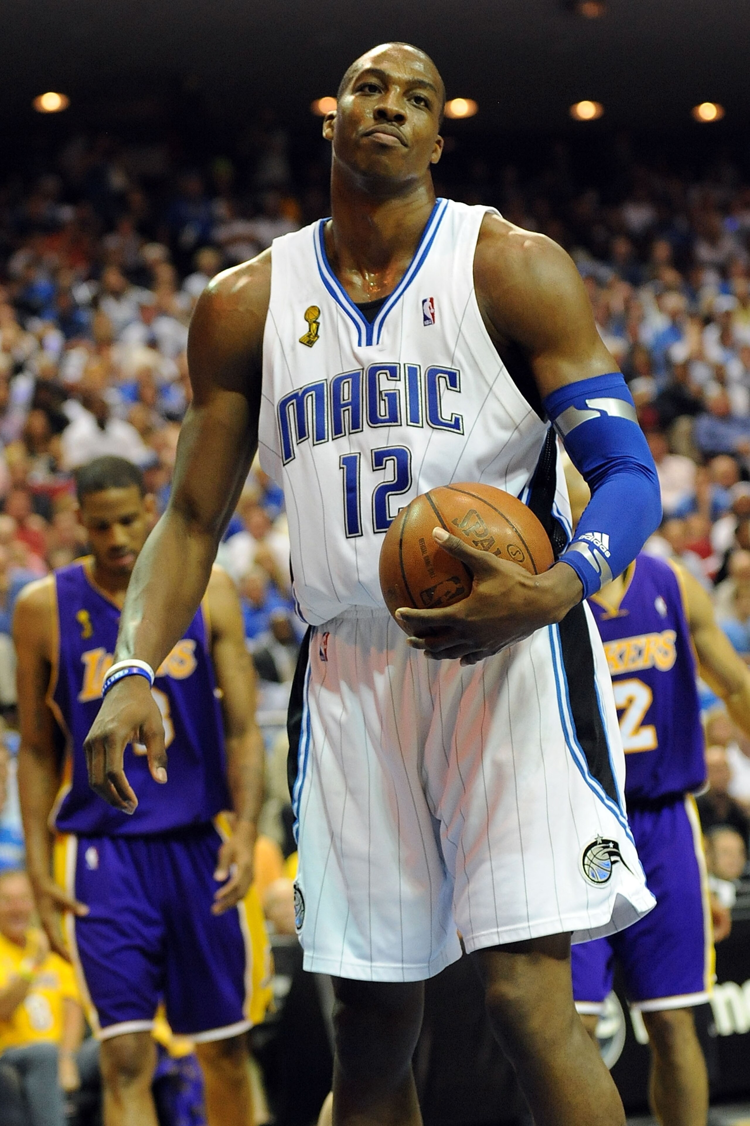 ORLANDO, FL - JUNE 14: Dwight Howard #12 of the Orlando Magic reacts in the third quarter of Game Five of the 2009 NBA Finals against the Los Angeles Lakers on June 14, 2009 at Amway Arena in Orlando, Florida. NOTE TO USER: User expressly acknowledges ORLANDO, FL - JUNE 14: Dwight Howard #12 of the Orlando Magic reacts in the third quarter of Game Five of the 2009 NBA Finals against the Los Angeles Lakers on June 14, 2009 at Amway Arena in Orlando, Florida. NOTE TO USER: User expressly acknowledges