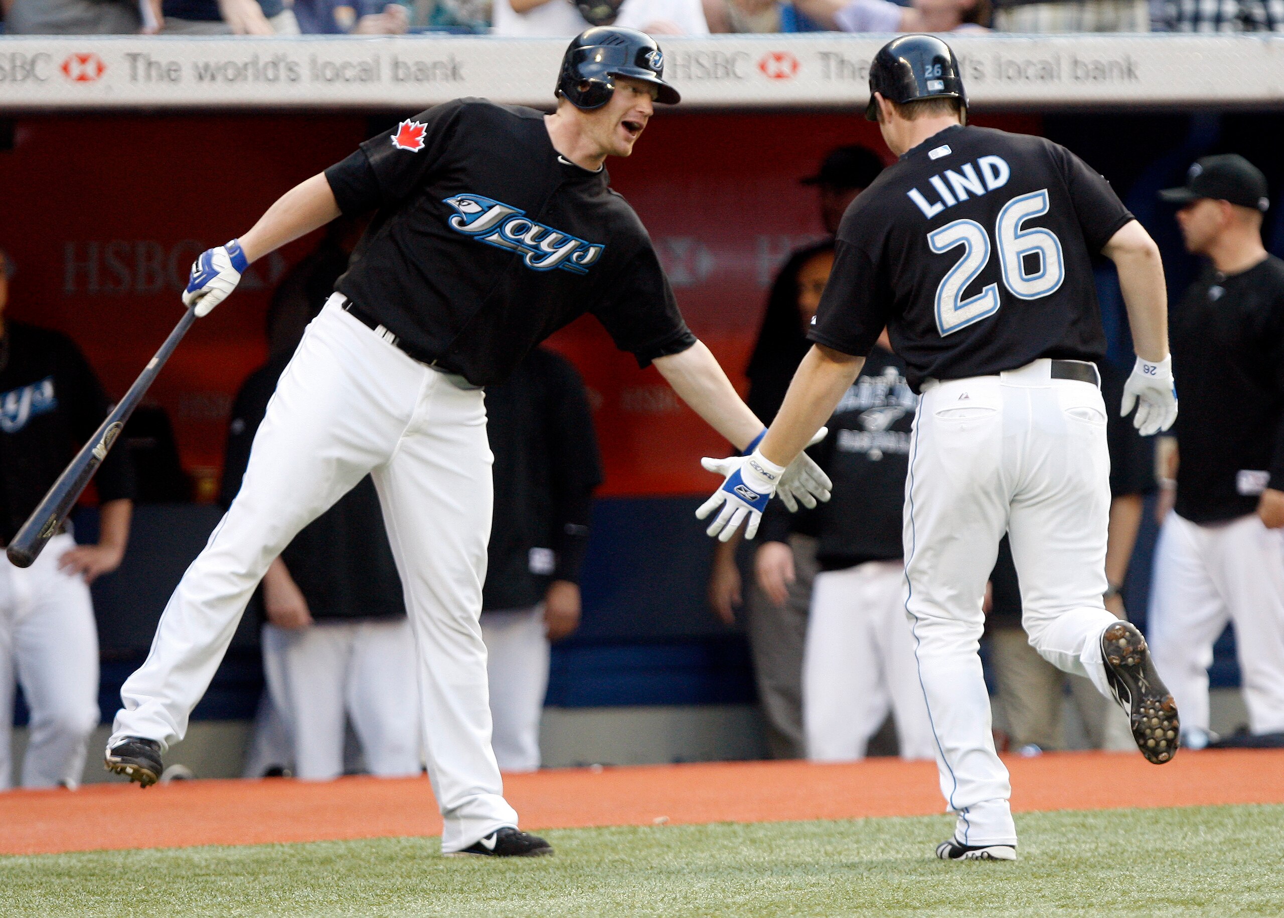 TORONTO - JULY 8: Lyle Overbay #35 and Adam Lind #26 of the Toronto Blue Jays celebrate Lind's home run against the Minnesota Twins during a MLB game at The Rogers Centre July 8, 2010 in Toronto, Ontario, Canada. (Photo by Abelimages/Getty Images)