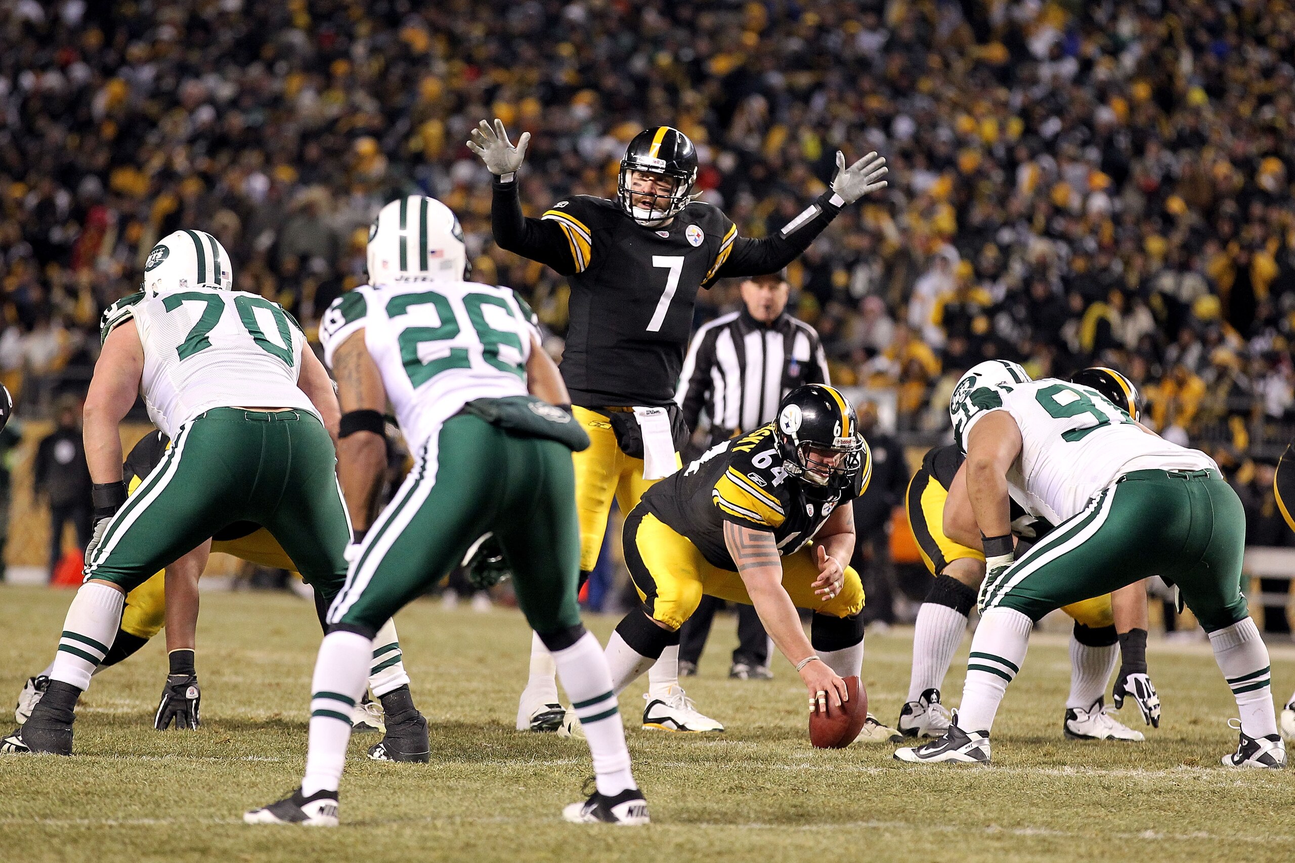 PITTSBURGH, PA - JANUARY 23:  Ben Roethlisberger #7 of the Pittsburgh Steelerscalls signals at the line of scrimmage behind center Doug Legursky #64 against the New York Jets during the 2011 AFC Championship game at Heinz Field on January 23, 2011 in Pitt