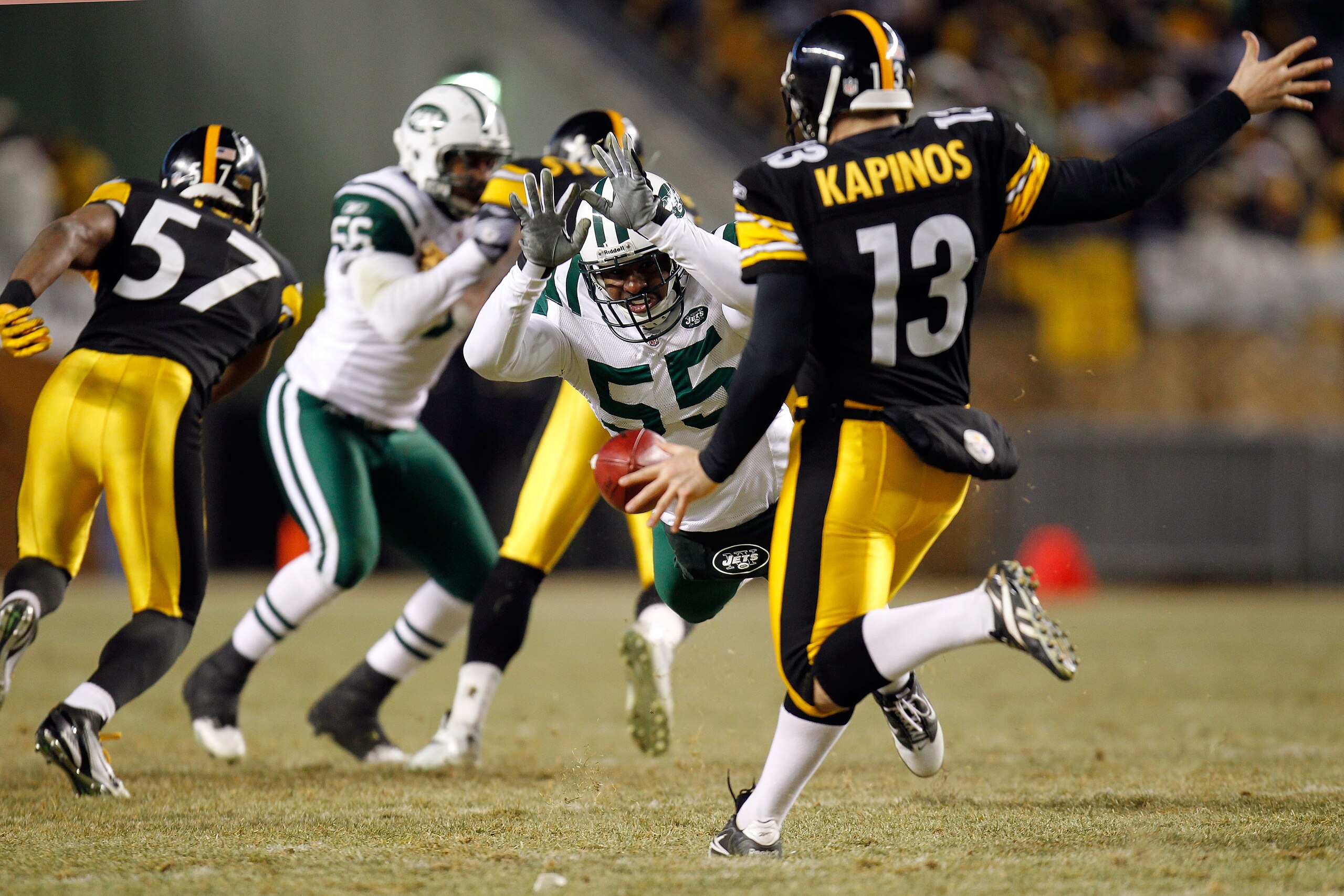 PITTSBURGH, PA - JANUARY 23:  Jamaal Westerman #55 of the New York Jets attempts to block a punt by Jeremy Kapinos #13 of the Pittsburgh Steelers and is called for roughing the kicker in the third quarter of the 2011 AFC Championship game at Heinz Field o