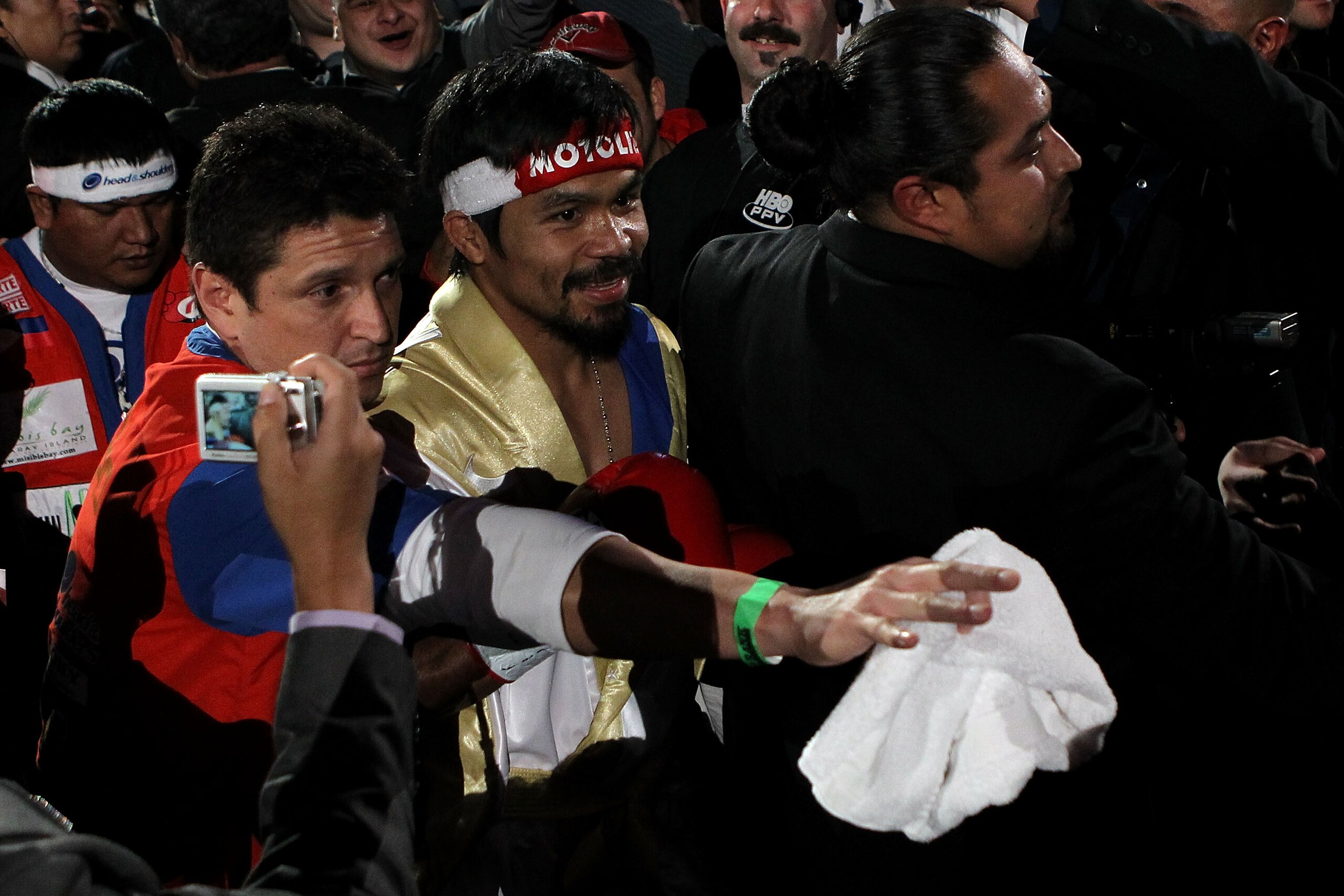 ARLINGTON, TX - NOVEMBER 13:  Manny Pacquiao of the Philippines makes his way to the ring for his fight against Antonio Margarito (black trunks) of Mexico during their WBC World Super Welterweight Title bout at Cowboys Stadium on November 13, 2010 in Arli