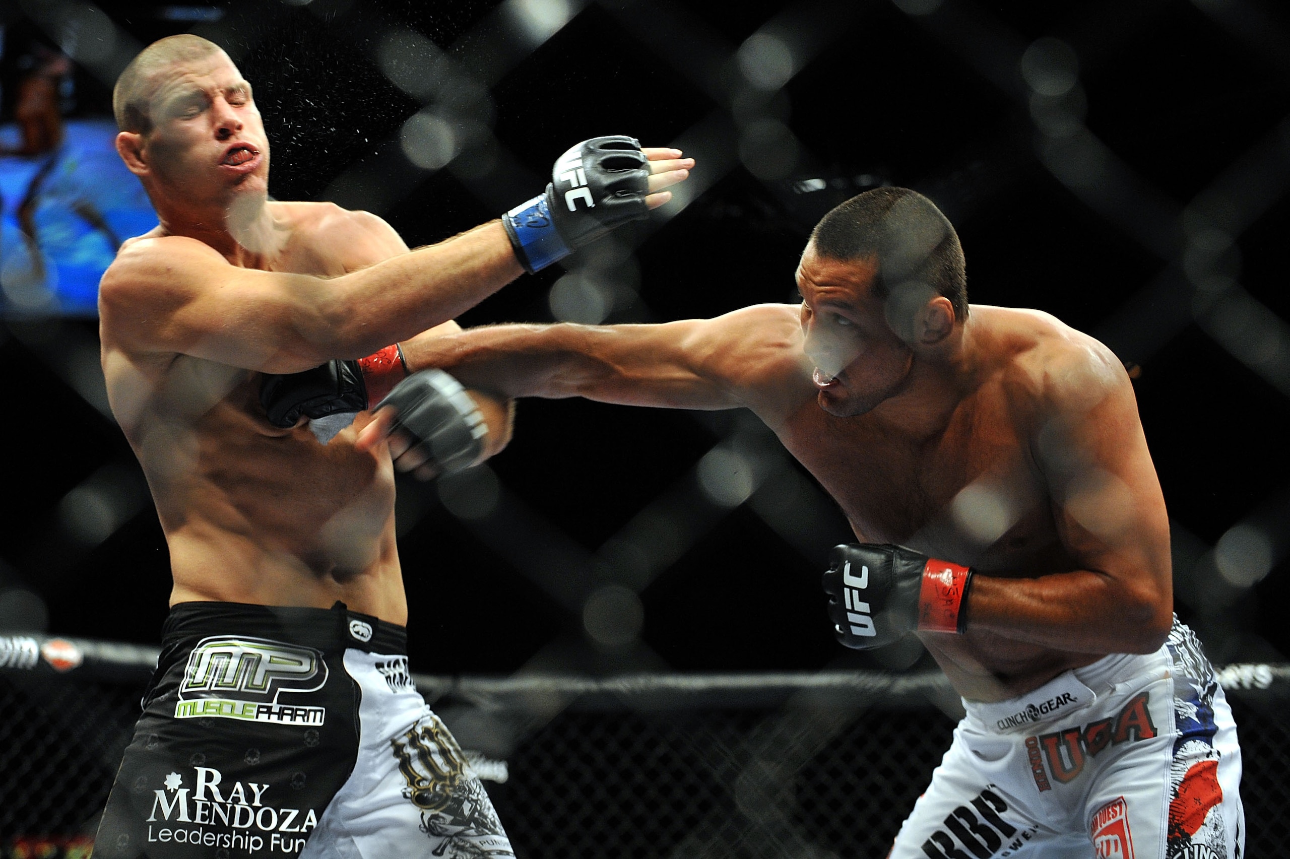 LAS VEGAS - JULY 11:  (R-L) Dan Henderson connects with a right to Mike Bisping during their middleweight bout during UFC 100 on July 11, 2009 in Las Vegas, Nevada.  (Photo by Jon Kopaloff/Getty Images)