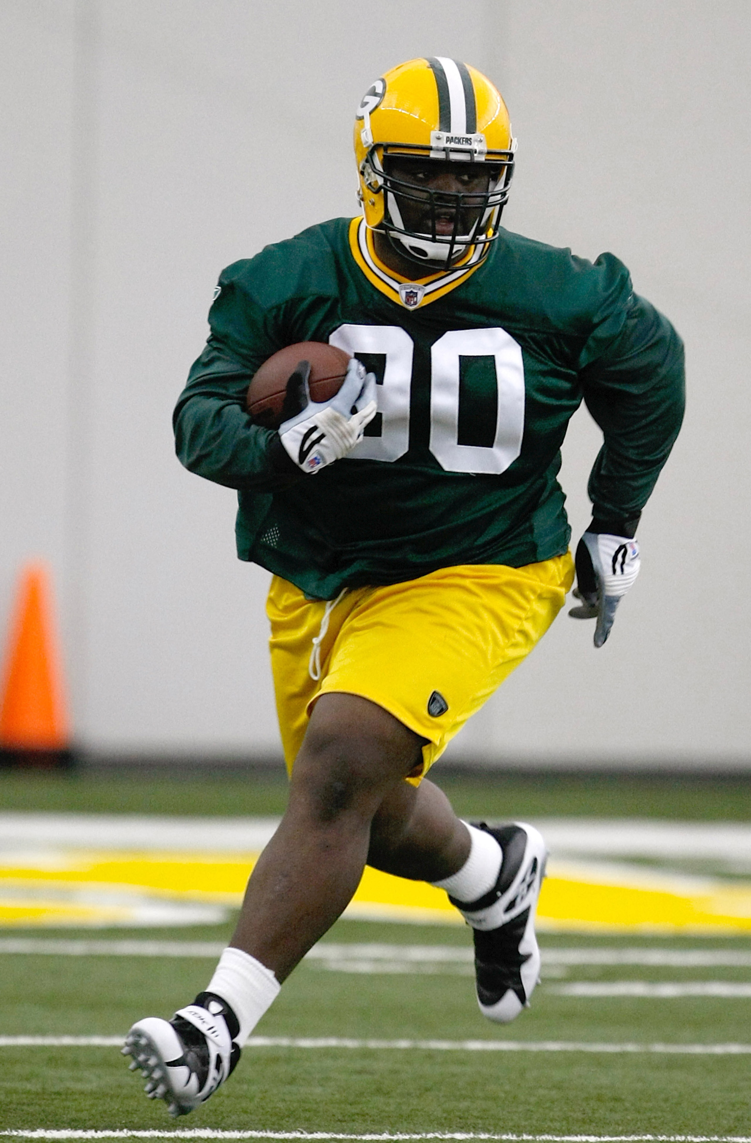 GREEN BAY, WI - MAY 1:  Defensive lineman B.J. Raji #90 runs with the football as he participates in practice drills during Green Bay Packers Minicamp at Don Hutson Center on May 1, 2009 in Green Bay, Wisconsin. (Photo by Scott Boehm/Getty Images)