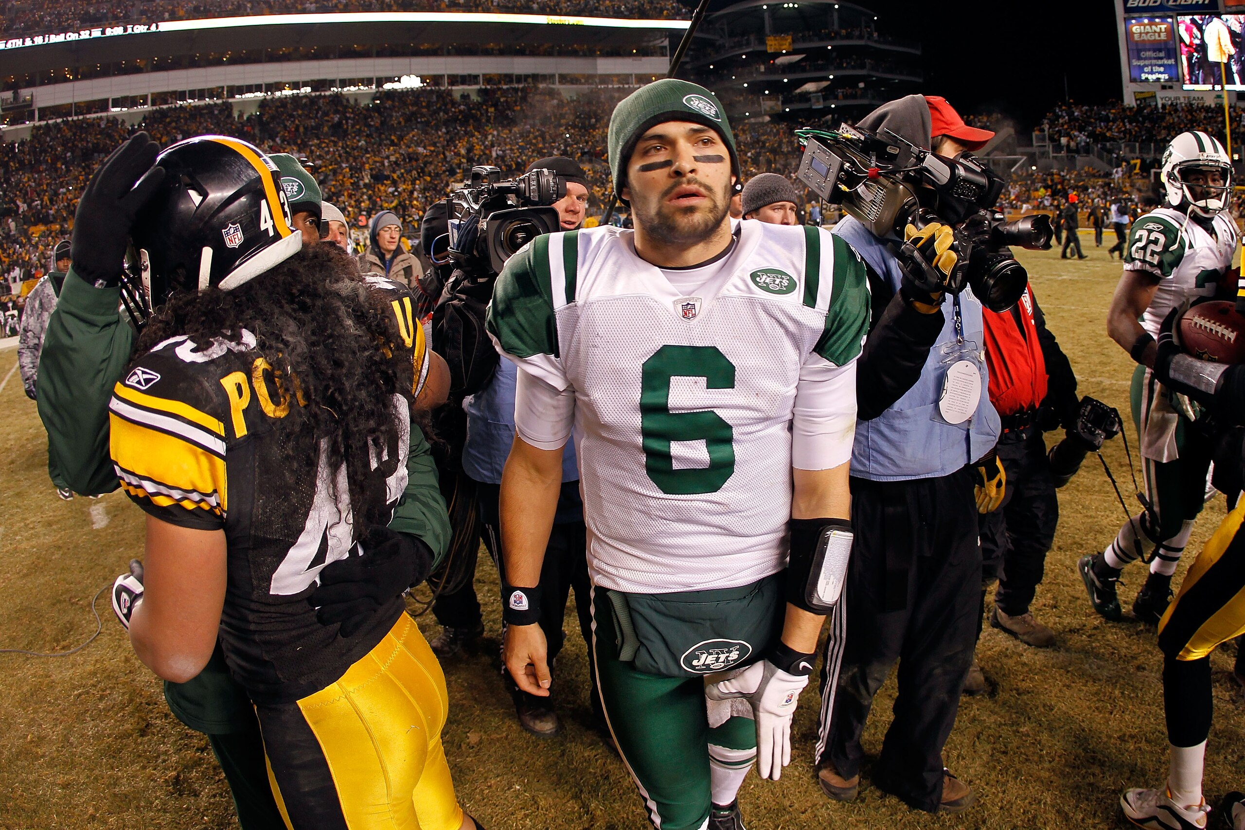 PITTSBURGH, PA - JANUARY 23:  Mark Sanchez #6 of the New York Jets leaves the field as Troy Polamalu #43 of the Pittsburgh Steelers looks on after the Pittsburgh Steelers defeated the New York Jets 24 to 19 in their 2011 AFC Championship game at Heinz Fie