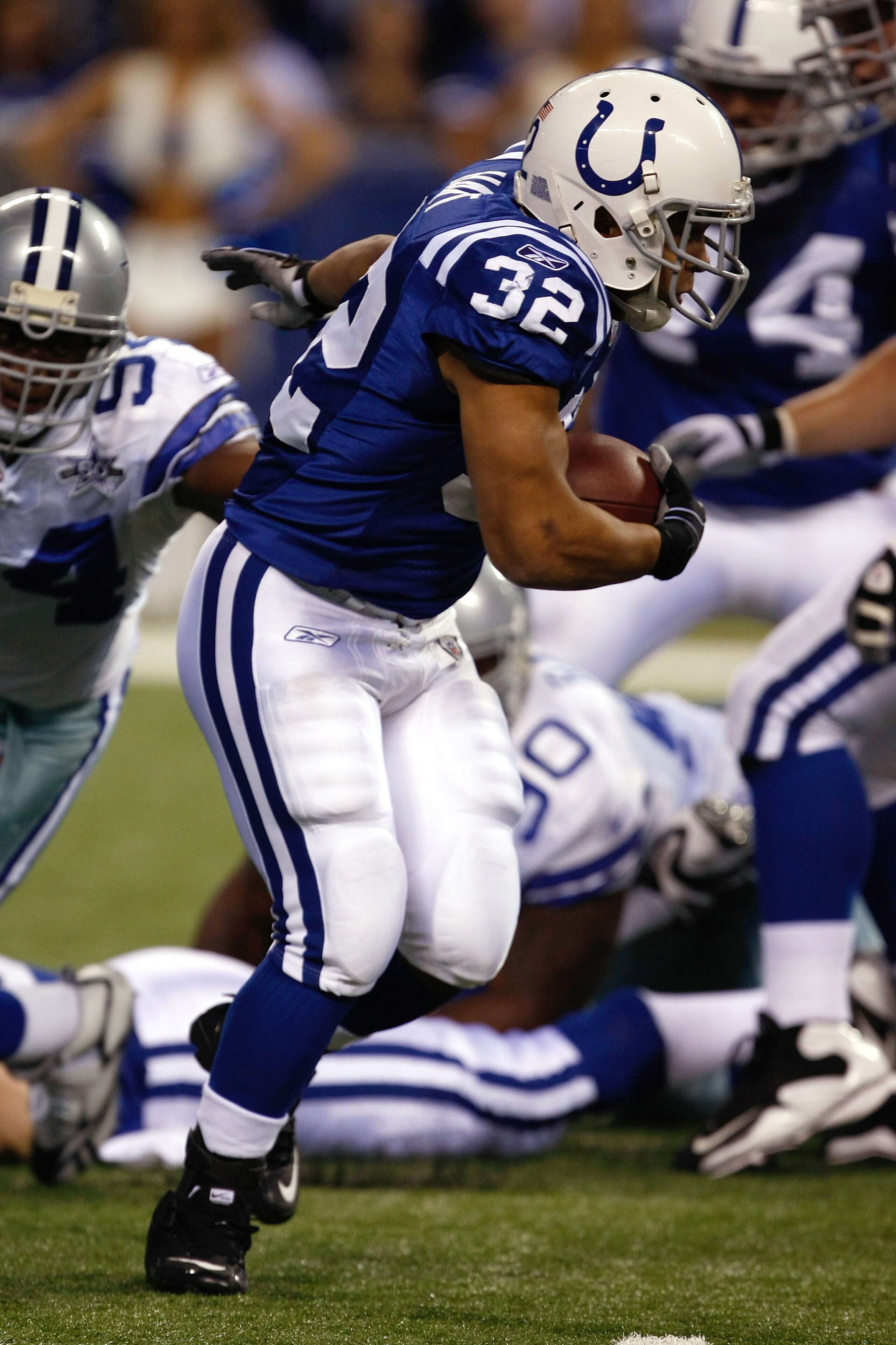 INDIANAPOLIS, IN - DECEMBER 05: Mike Hart #32 of the Indianapolis Colts runs against the Dallas Cowboys at Lucas Oil Stadium on December 5, 2010 in Indianapolis, Indiana. The Cowboys defeated the Colts 38-35 in overtime. (Photo by Scott Boehm/Getty Images