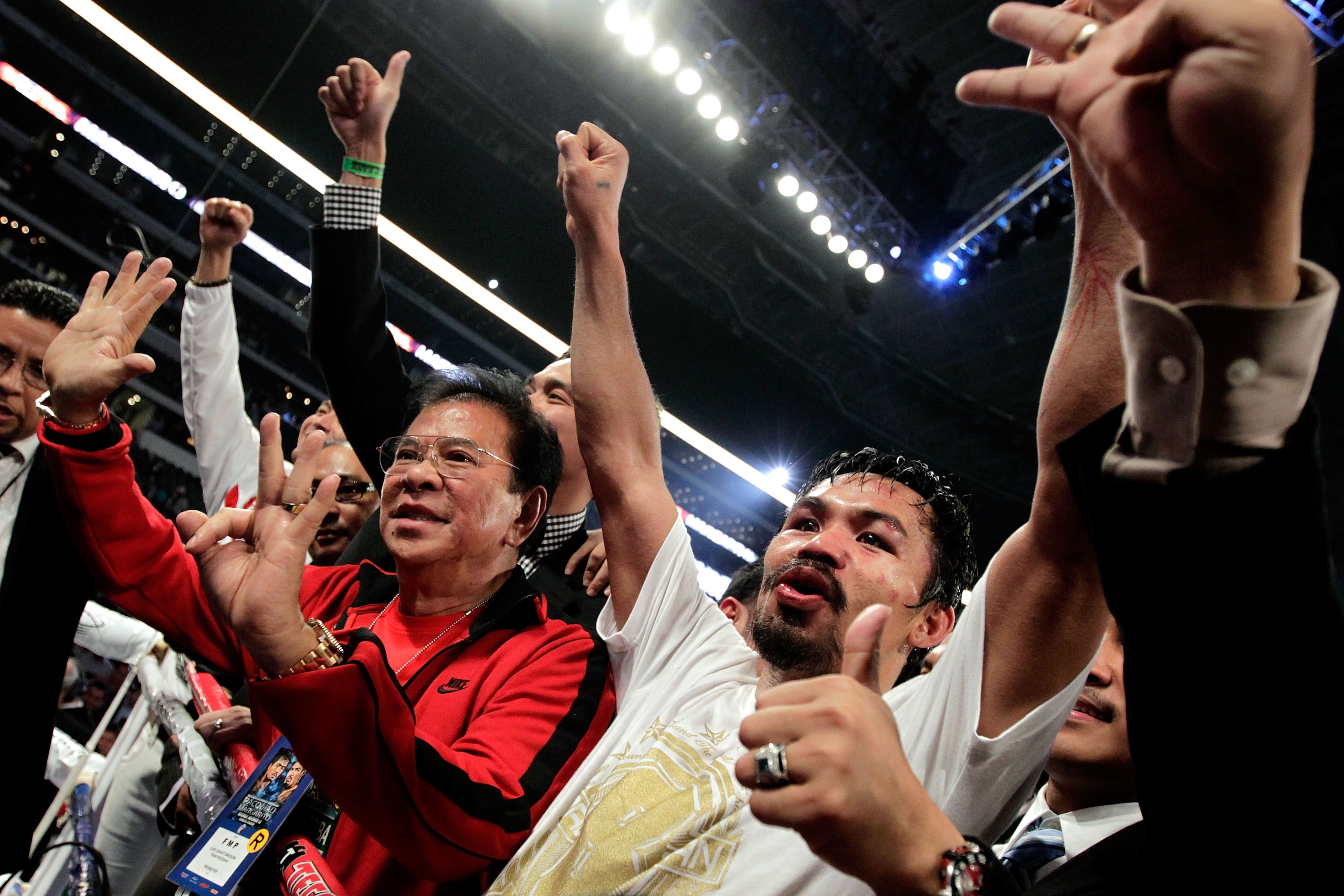 ARLINGTON, TX - NOVEMBER 13:  Manny Pacquiao (white trunks) of the Philippines celebrates after he was declared the winner by a unanimous decision against Antonio Margarito (black trunks) of Mexico during their WBC World Super Welterweight Title bout at C