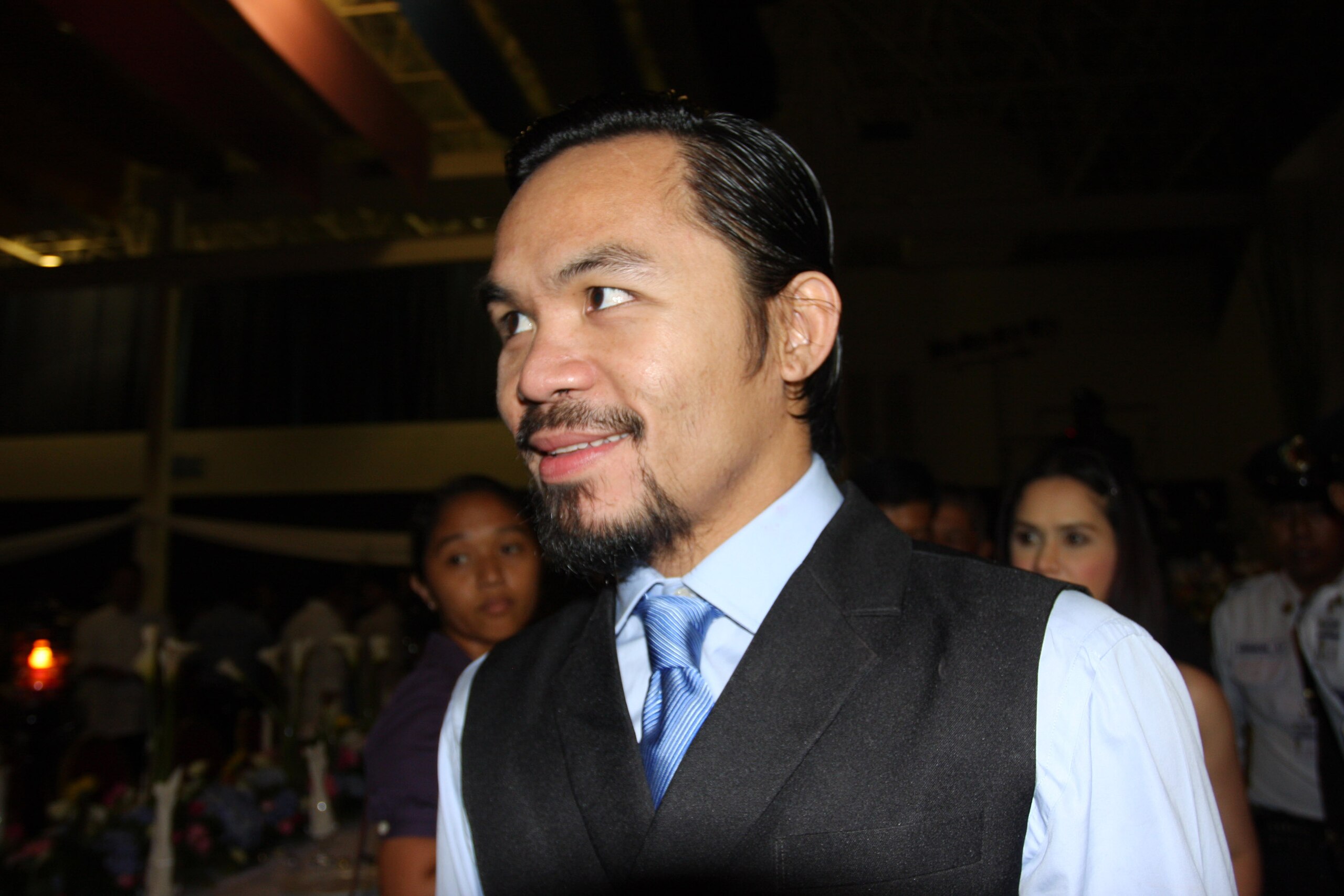GENERAL SANTOS, PHILIPPINES - MAY 15:  World welterweight boxing champion Manny Pacquiao arrives at the KCC Mall on May 15, 2010 in General Santos, Philippines. Pacquiao was there to celebrate his election on becoming a member of House of Representatives