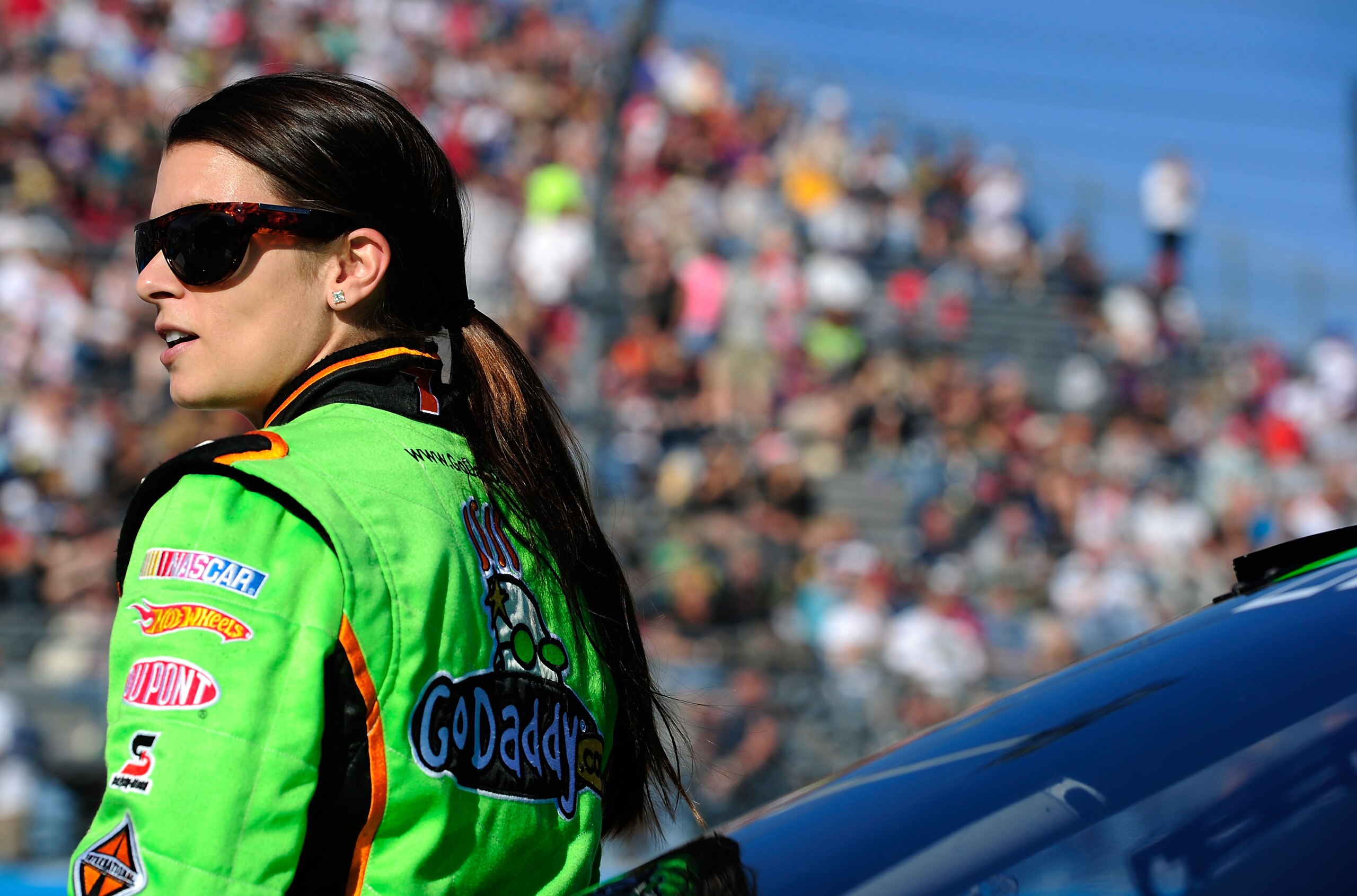 AVONDALE, AZ - NOVEMBER 13:  Danica Patrick, driver of the #7 GoDaddy.com Chevrolet, stands by her car prior to the NASCAR Nationwide Series WYPALL 200 at Phoenix International Raceway on November 13, 2010 in Avondale, Arizona.  (Photo by Robert Laberge/G