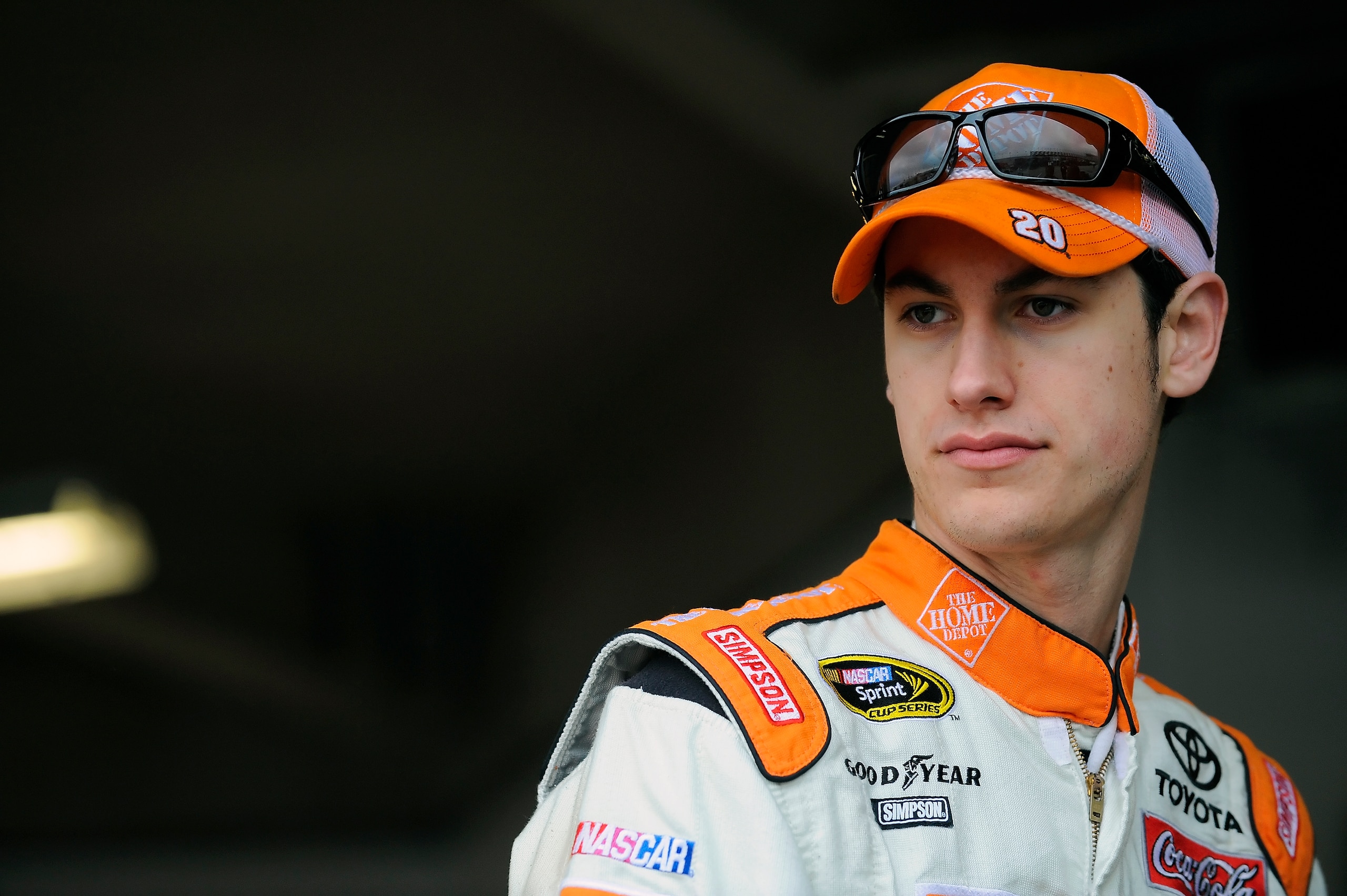 DAYTONA BEACH, FL - JANUARY 22:  Joey Logano, driver of the #20 Home Depot Toyota, stands in the garage area during testing at Daytona International Speedway on January 22, 2011 in Daytona Beach, Florida.  (Photo by Jared C. Tilton/Getty Images for NASCAR