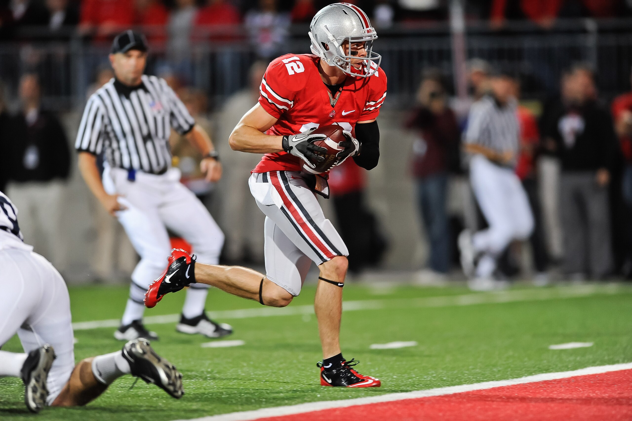 COLUMBUS, OH - NOVEMBER 13: Dane Sanzenbacher #12 of the Ohio State Buckeyes scores a touchdown against the Penn State Nittany Lions at Ohio Stadium on November 13, 2010 in Columbus, Ohio. (Photo by Jamie Sabau/Getty Images) COLUMBUS, OH - NOVEMBER 13: Dane Sanzenbacher #12 of the Ohio State Buckeyes scores a touchdown against the Penn State Nittany Lions at Ohio Stadium on November 13, 2010 in Columbus, Ohio. (Photo by Jamie Sabau/Getty Images)
