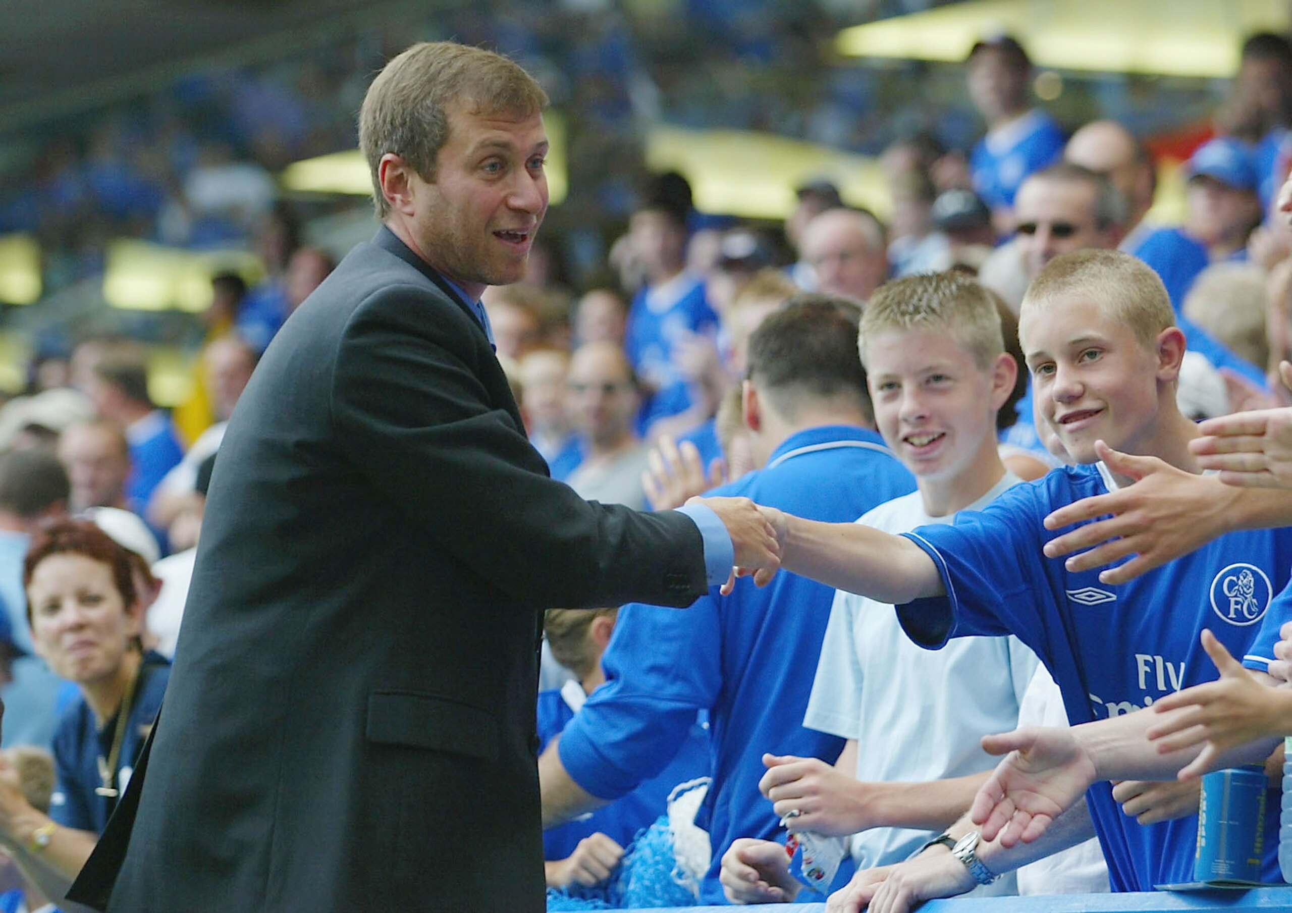 LONDON - AUGUST 23:  Club owner Roman Abramovich of Chelsea meets the fans during the FA Barclaycard Premiership match between Chelsea and Leicester City at Stamford Bridge on August 23, 2003  in London, England. (Photo By Ben Radford/Getty Images)