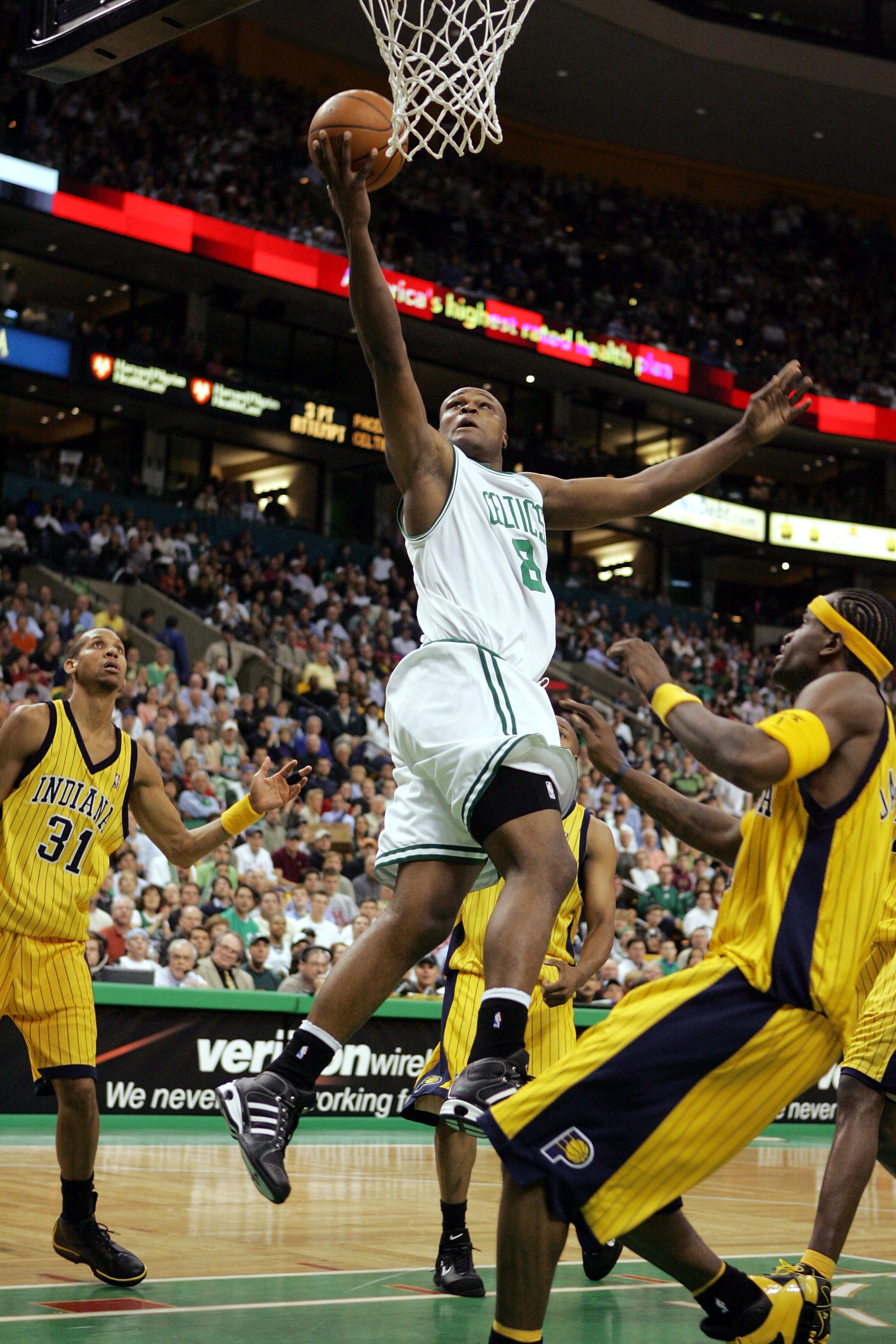 BOSTON - MAY 7:  Antoine Walker #8 of the Boston Celtics scores on a layup against the Indiana Pacers while Reggie Miller #31 of the Indiana Pacers watches in Game seven of the Eastern Conference Quarterfinals during the 2005 NBA Playoffs on May 7, 2005 a