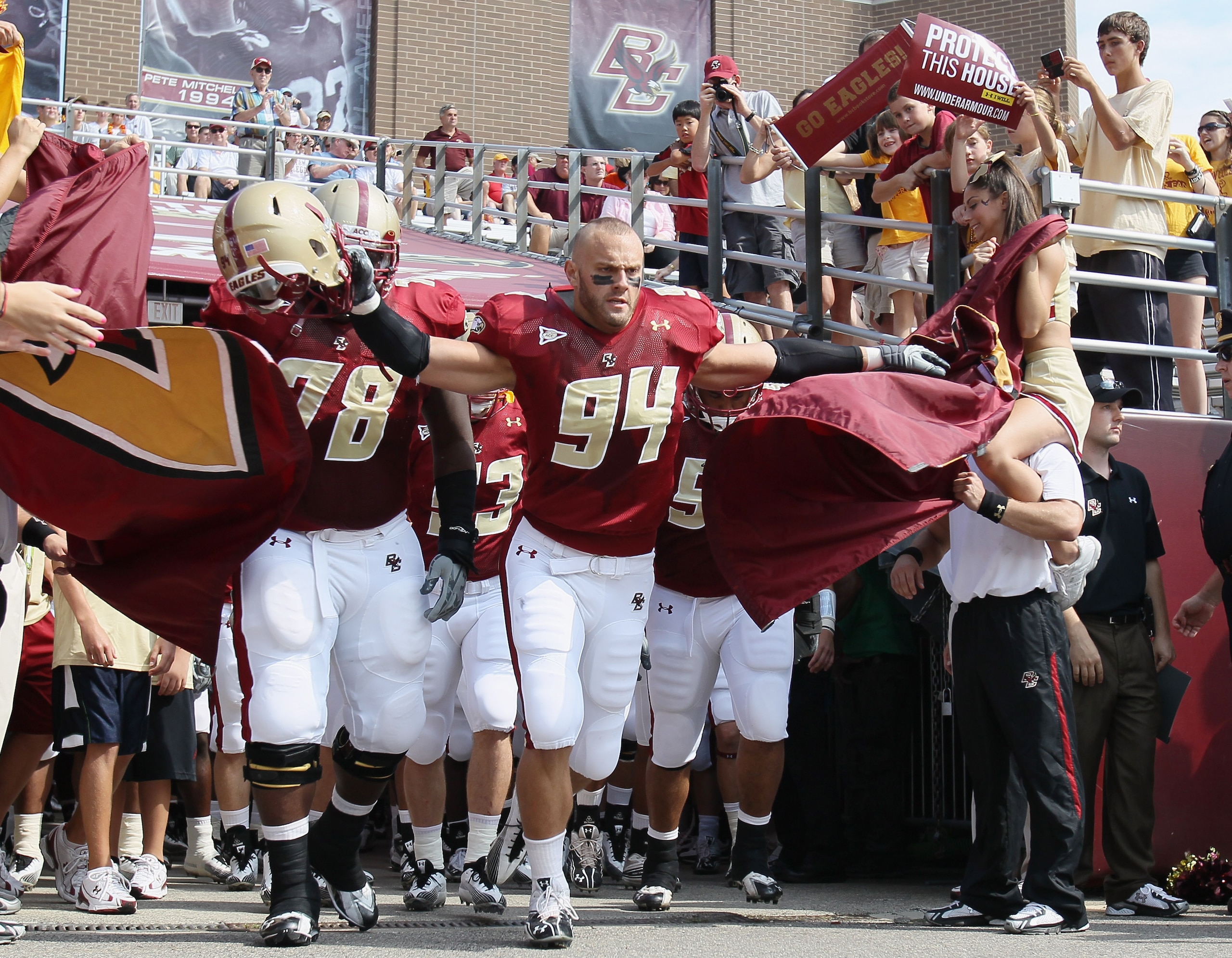 CHESTNUT HILL, MA - SEPTEMBER 25: Mark Herzlich #94 and Thomas Claiborne #78 of the Boston College Eagles lead the team out on the field before the game against the Virginia Tech Hokies on September 25, 2010 at Alumni Stadium in Chestnut Hill, Massachuse CHESTNUT HILL, MA - SEPTEMBER 25: Mark Herzlich #94 and Thomas Claiborne #78 of the Boston College Eagles lead the team out on the field before the game against the Virginia Tech Hokies on September 25, 2010 at Alumni Stadium in Chestnut Hill, Massachuse