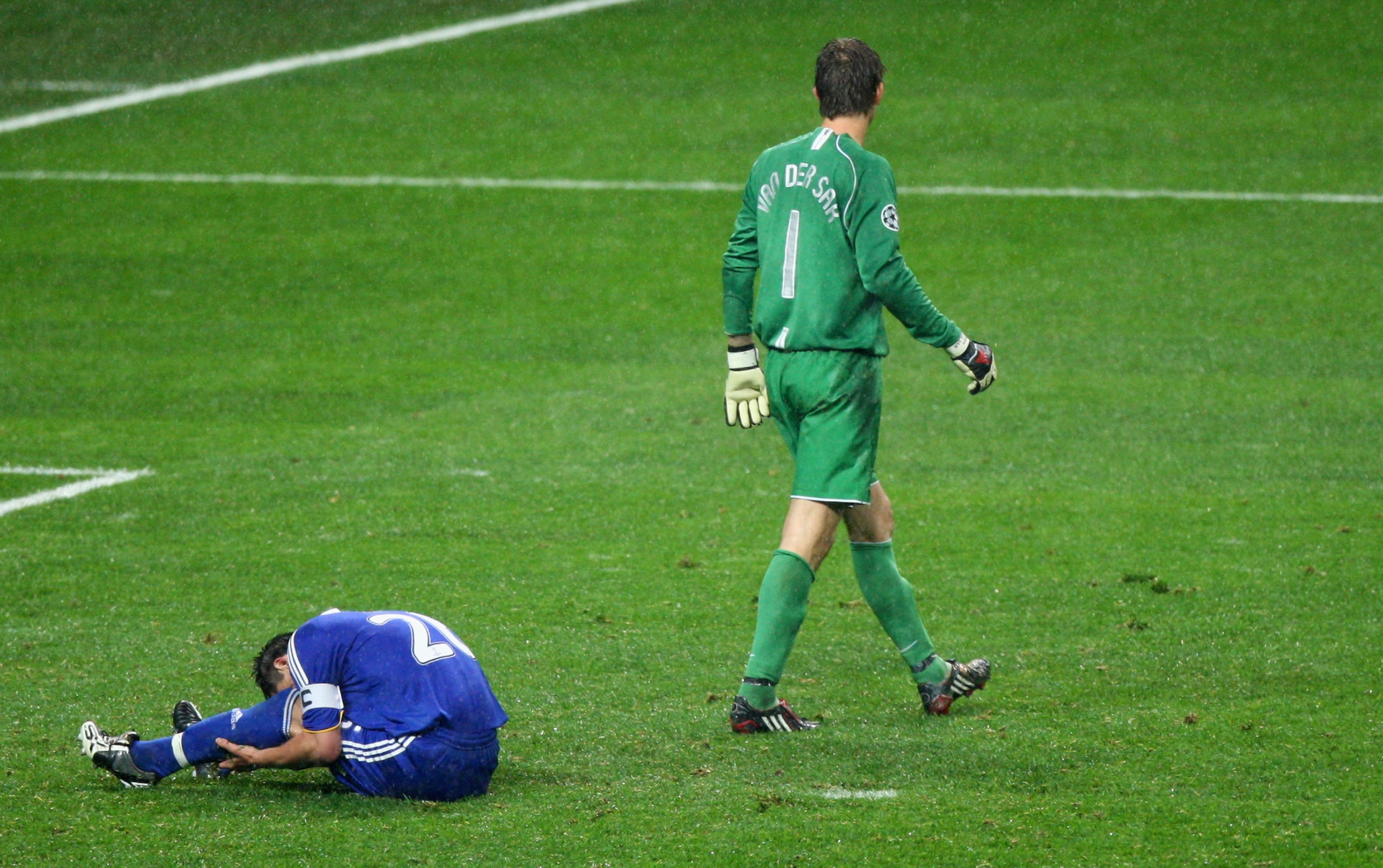 MOSCOW - MAY 21:  Edwin Van der Sar of Manchester United walks past John Terry of Chelsea, who has just missed a penalty attempt during the UEFA Champions League Final match between Manchester United and Chelsea at the Luzhniki Stadium on May 21, 2008 in