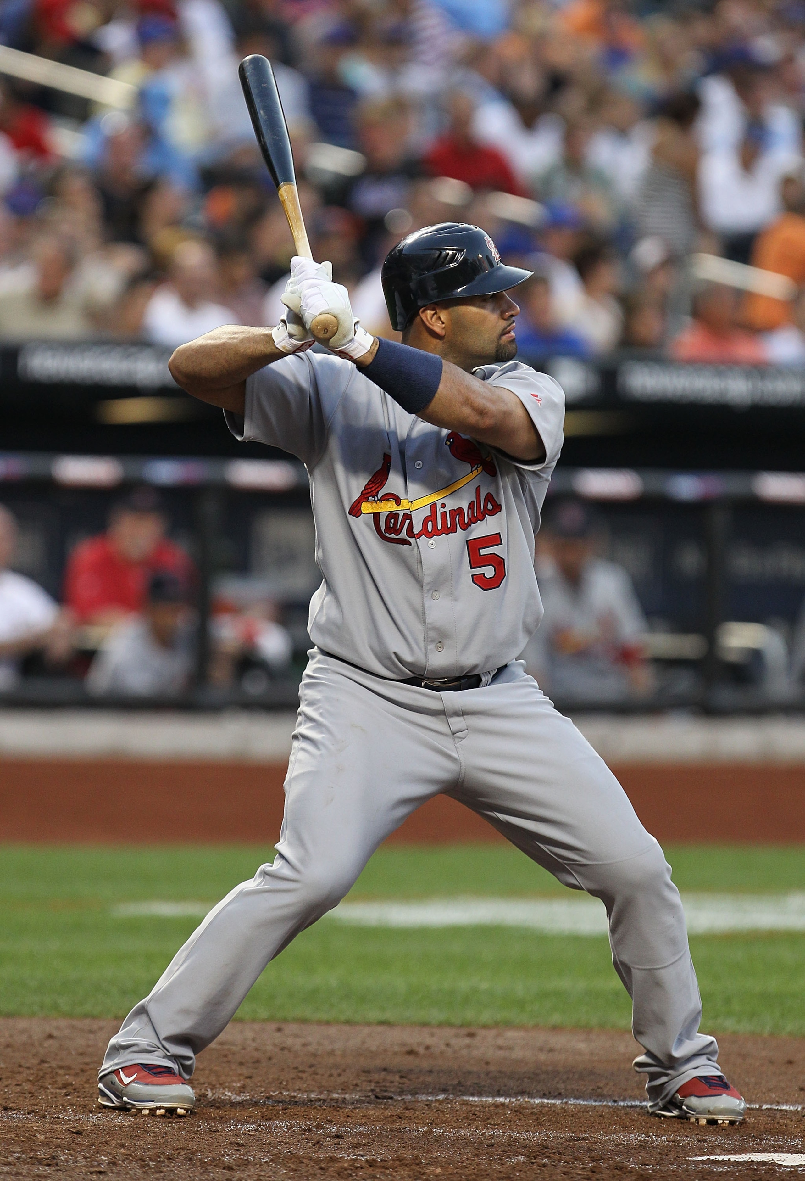 NEW YORK - JULY 27:  Albert Pujols #5 of the St. Louis Cardinals pitches against  the New York Mets during their game on July 27, 2010 at Citi Field in the Flushing neighborhood of the Queens borough of New York City.  (Photo by Al Bello/Getty Images)