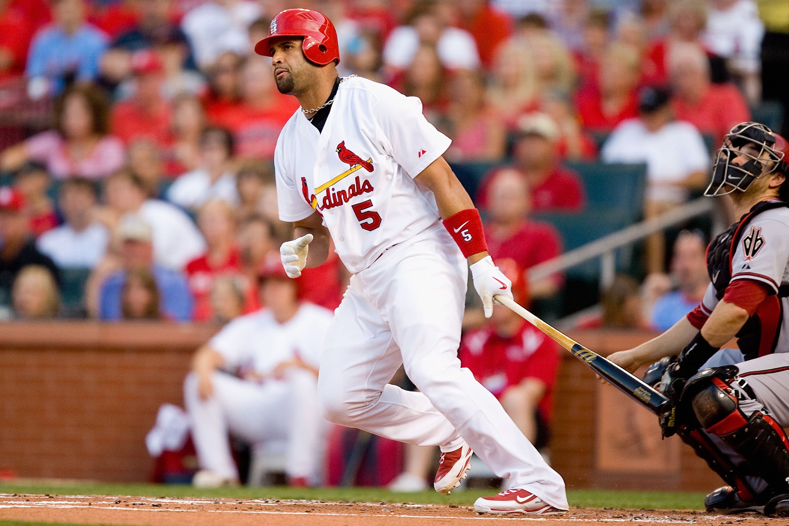 ST. LOUIS - JUNE 28:  Albert Pujols #5 of the St. Louis Cardinals hits an RBI double against the Arizona Diamondbacks at Busch Stadium on June 28, 2010 in St. Louis, Missouri.  (Photo by Dilip Vishwanat/Getty Images)